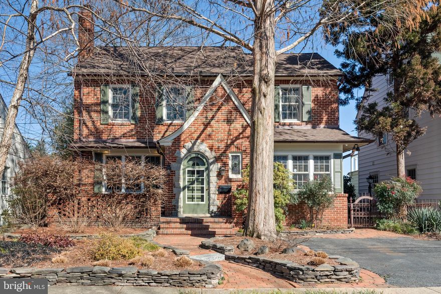 Amazing, immaculately maintained/updated brick Murray Hill home with fabulous great room/kitchen addition.  Architect designed renovation was skillfully crafted to seamlessly bring together the classic and maintain the charm with great details such as new arched doorways and a curved window wall looking out into the beautifully planned and executed outdoor living. Welcome family and friends onto the lovely front porch and through the unique round door into the enchanting vestibule. Gather around the newly lined fireplace in the living room or at the dining room table overlooking the bay window or the great room/kitchen with the oversized island with room for all. Expertly designed for great flow and real entertaining, home boasts 1400+ sq feet of main level living including both an office and a study with doors so spaces can be made more private. 2nd level has three pretty rooms, a deck and laundry. Side entrance into the office can be used to access the finished lower level where this is a half bath, great storage and an outside entrance.  The stunning garden has been the highlight of two of Annapolis' "Secret Garden Tours" and has magical terraces to relax and share a drink and the perfect potting shed. Driveway parks two cars but street requires no permit to park. This outstanding "walk to town location" is  just a few blocks to Spa Creek's public landings to hop on the water taxi or for easy kayak access and many fun restaurants and entertaining and shopping.