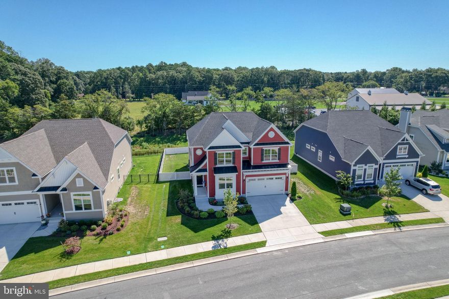 Welcome to Hailey’s Glen, a sought-after Schell Brothers community in Lewes, Delaware. This less than two-year-young craftsman-style home rests on a private fenced in lot. As you walk onto the charming and inviting front porch you're immediately welcomed into an open floor plan bathed in the natural light, seamlessly blending modern convenience with the tranquility of a coastal warm retreat. The chef’s kitchen has all the modern conveniences with a large center island, double wall oven, induction cooktop and is open to the dining area and the great room, where vaulted ceilings frame the peaceful backyard views.
On the main level, the spacious primary suite has trey ceilings and offers two large walk-in closets and a spacious primary bath. An inviting first-floor office provides the perfect space for work or quiet reading, while custom touches such as hallway shiplap add warmth and character.
Upstairs, a large airy loft offers flexibility for recreation or relaxation, joined by three additional bedrooms, a full bath, and impressive storage space which can expand to a fifth bedroom if desired. Outdoors, the generous yard has ample room for a private pool, creating the perfect setting for entertaining or unwinding at day’s end. Beautiful LVP flooring adds warmth throughout the home.
Just minutes from Delaware’s famous beaches, fabulous dining, shopping, and convenient access to Route 1, this home offers not just a place to live but a true coastal lifestyle.