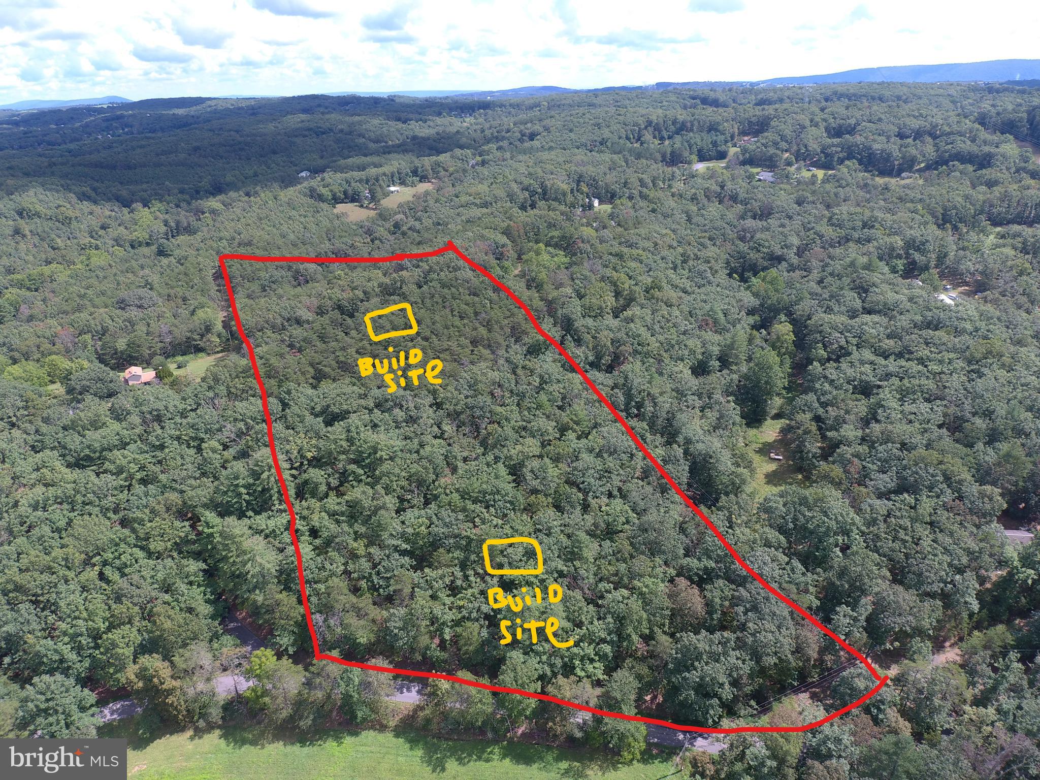 A RARE FIND.....9 WOODED ACRES FRONTING ON QUIET PAVED COUNTRY ROAD, ONLY 2 MILES FROM THE VIRGINIA LINE AND 20 MINUTES WEST OF WINCHESTER, VA. IT'S SUPER HARD TO FIND ACREAGE IN THIS SOUGHT AFTER LOCATION. NO HOA AND NO RESTRICTIONS, EXCEPT THAT "NO ABANDONED VEHICLES ARE TO BE KEPT ON THE PROPERTY"......OTHER THAN THAT....YOU CAN DO WHATEVER YOU WANT! MULTIPLE BUILDING SITES, GOOD SPOT JUST OFF THE PAVED ROAD OR GO TO THE TOP OF THE RIDGE FOR MAXIMUM PRIVACY......ELECTRICITY ALONG THE EDGE AND THROUGH THE MIDDLE OF THE PROPERTY, THIS MEANS HUGE SAVINGS $$$$ ON INFRASTRUCTURE COSTS. ENOUGH LAND TO HUNT, SHOOT & RIDE ATV'S.....ALL WITHIN A SHORT COMMUTE TO WINCHESTER AND EXACTLY 100 MILES FROM DOWNTOWN DC! GETTING TIRED OF OPPRESSIVE STATE LAWS? HIGH TAXES? RIDICULOUSLY HIGH COST OF LIVING? MAKE THE MOVE TO ALMOST HEAVEN WV AND EXPERIENCE THE FREEDOMS YOU'VE LOST!