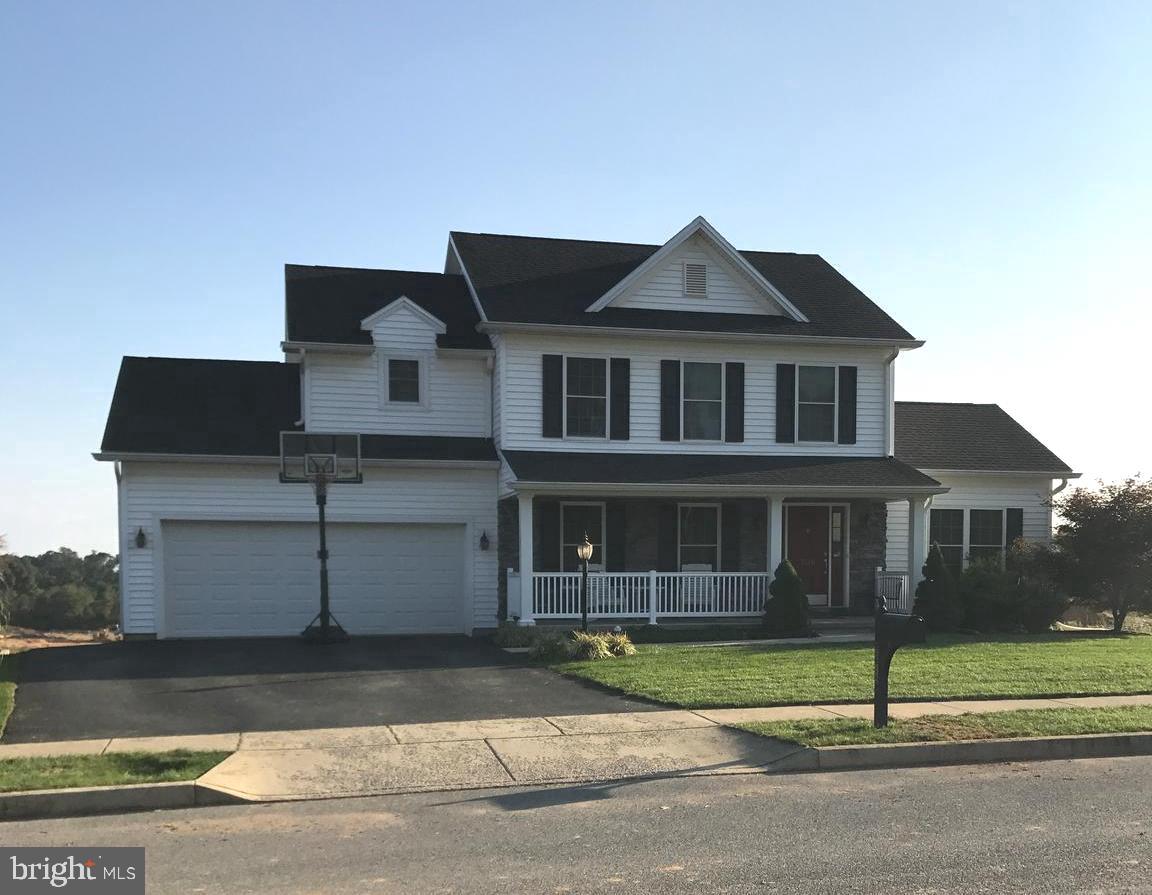 BETTER THAN NEW & PRICED BELOW THE NEW BUILDS!!! Beautiful 2-Story home sits on a corner lot that has a future street which will be completed in the 3rd phase of the Chambers Pointe Development. This home is better than new w/a large finished lower level giving 800 extra sq.ft. w/a Rec Rm & a 4th BR/Office.  Home has been freshly painted & new carpet installed on the main level & stairway.  Beautiful HW flooring in the foyer leads to the Kitchen, Dining Rm & Great Rm. Kitchen boasts new granite countertops, stainless steel appliances & sliding glass door that leads out to a large deck that overlooks the back yard. Great for entertaining.  The Great Rm. includes a vaulted ceiling and a unique gas FP that gives extra warmth on these cold winter days. A covered front porch & 2-car garage completes this home.  All this plus an HSA Home Warranty!!