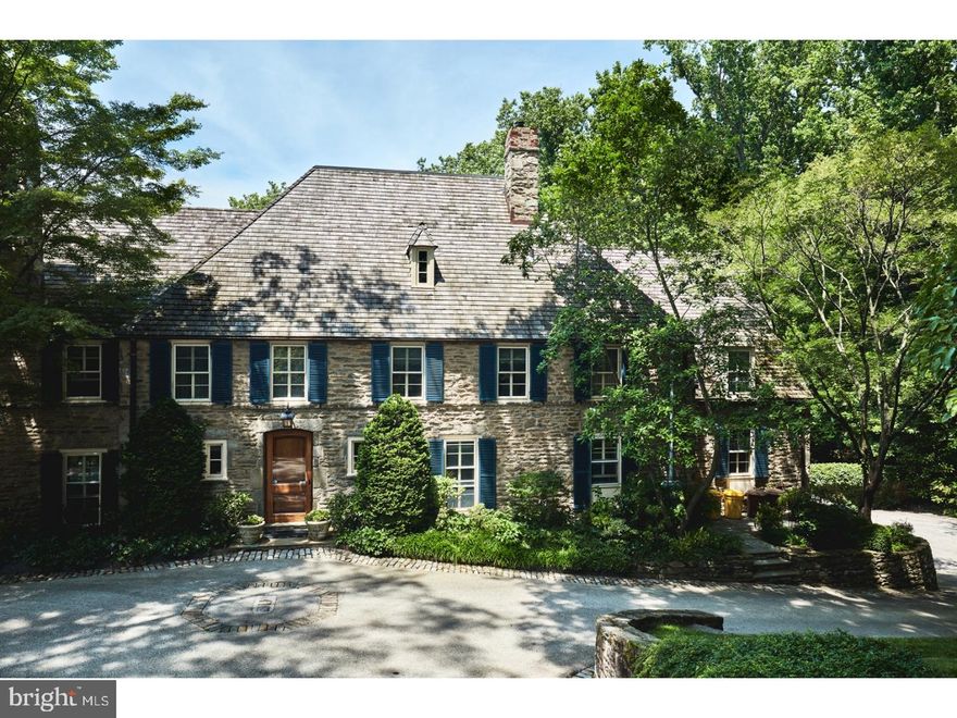 Crafted in 1928 by locally-admired architect/builder, Walter Durham, this classic stone colonial home offers the best the Main Line has to offer.  Sited on over 2 acres with mature landscaping and artful hard-scaping, the home boasts 5 Bedrooms, a newer and spacious Kitchen with adjoining Family Room and Garden Room, and has a great flow to the rooms for everyday life and elegant entertaining. Every attention to detail has been considered and executed with care in this home.  The Master Suite consists of a large Bedroom, a Dressing Room and two full and updated Baths. Off the Lower Level is a stone-walled Hallway with brick flooring  which leads to the stunning Wine Cellar.  Nearby is a Bath/Dressing Room for those using the nearby pool.  An expansive Terrace opens from the Garden Room and offers a wonderful outdoor space for dining, relaxing and enjoying the stunning views. A walk-up Attic and full, unfinished Basement provide terrific storage space. Located with easy access to the amenities of the Main Line and the city of Philadelphia, this is a home to cherish.