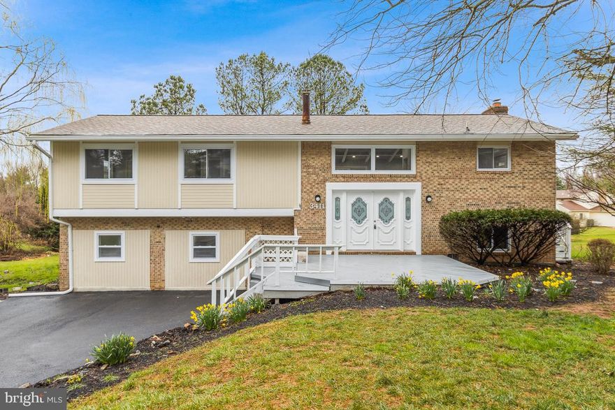 $10,000 sellers help for using sellers preferred lender. This beautiful and spacious split level (4 bedrooms and 3 full baths) is now available in the Reisterstown Md area. There is so much to love in this property - vaulted ceilings, spacious open floor plan, tons of natural light, and a neutral color palette with lots of modern updates throughout! The welcoming main level features a Living Room, Dining Room, and Kitchen that naturally flow together making it easy to entertain while you cook with its modern fixtures and stainless-steel appliances. Features include a custom-built fireplace in the LR, tray ceilings throughout the main and lower levels, crown molding, chair rail, granite countertops, and hardwood floors. The fully finished lower level includes a HUGE Entertainment Room complete with a wet bar and Family Room.  The lower level also boasts a nice-sized bedroom, a full bath, and a large screened-in porch (330 sq ft). The upper level includes 3 spacious bedrooms including a Primary Bedroom with a private bath. Bath has soaker tub, double vanity, and large stand up shower. The exterior will not disappoint with a huge rear deck for outdoor entertaining and 1 acre of land!  You don't want to miss it.