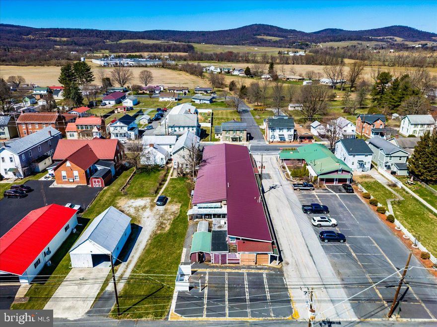 NEW PRICE – Great Commercial Opportunity. This 10,000+ sq ft commercial property presents a rare opportunity for investors or owner-operators seeking flexibility and scale. The mostly open layout allows for easy customization, while existing kitchen, prep, and warehouse areas support a variety of uses—from retail and dining to distribution or specialty services. With 36+ paved parking spaces, public and private restrooms, and strong adaptability, this property is well-positioned for immediate use or future reconfiguration. Available for sale or lease.