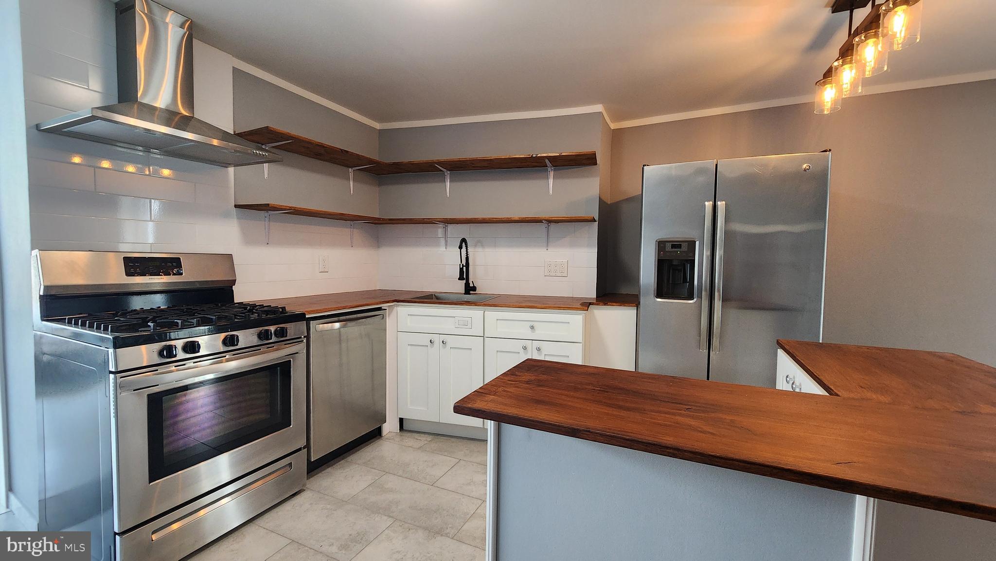 Welcome home to this beautifully renovated 2 bedroom, 1 bath rental in the heart of Pennsport, located catty-corner from beloved Dickinson Square Park. Enjoy being surrounded by some of South Philly’s favorite neighborhood spots: sip your morning latte at Herman’s Coffee, grab a steak from Jaxx, or meet friends for brunch at Rebel & Wolf just steps away. Inside, the apartment offers updated finishes throughout. The elevated kitchen flows into a contemporary living area, making it perfect for both everyday living and entertaining. Two comfortable bedrooms and a stylish full bath provide a cozy retreat.
By October, you’ll be able to enjoy a brand-new outdoor deck - an ideal space to relax, dine al fresco, or host friends under the city lights. Convenience is unmatched here: you’re minutes from Giant, Target, Acme, Ikea, Home Depot, Lowe’s, HomeGoods, Ulta, and more, making errands a breeze. This is South Philly living at its best - a renovated home with style, comfort, and the ultimate convenience.