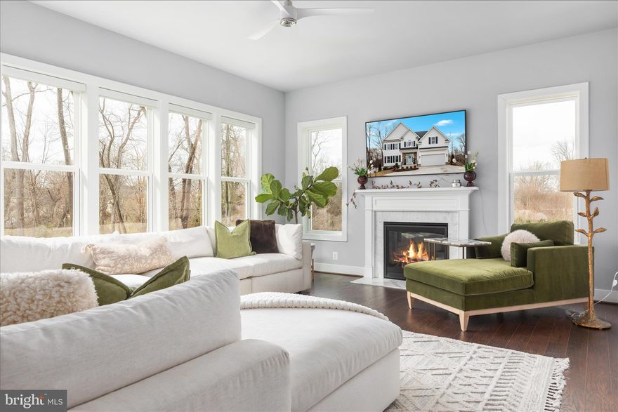 Welcome to this stunning and rarely available St. Philip model, offering over $240,000 in premium upgrades and located in the highly sought-after Brandy Woods subdivision. Thoughtfully designed for modern living, this exceptional home is situated on a premium lot backing to a forest nature reserve for ultimate and lasting privacy. Featuring 4 bedrooms, 5.5 bathrooms, a 2-car front-load garage, and a fully finished walkout basement, this home is the gem of Mount Vernon. The outdoor living spaces are truly extraordinary. Enjoy a spacious Trex deck, a beautifully designed hardscape flagstone patio, a wood-burning fireplace with a custom stone wood box, hot tub, and a fully fenced backyard with classic white pickets that is perfect for relaxing or entertaining under the stars. 
Fewer than three years young and showing like a model home, this meticulously landscaped property offers impressive curb appeal and over 5,300 square feet of impeccably maintained living space.
Step inside to a grand foyer highlighted by an elegant staircase. The main level features a formal sitting room with a decorative fireplace imported from England, a formal dining room with coffered ceiling and custom trim, a private office with book shelves with enchanting forest views, a powder room, and an expansive great room filled with natural light from a stunning wall of windows and a cozy gas fireplace with mantel. The gourmet kitchen is a true showpiece, complete with stainless steel appliances, a gas cooktop, built-in microwave, wall oven, quartz countertops, custom white cabinetry, an impressive tile backsplash, and a large center island with bar seating which is ideal for everyday living and entertaining.
Upstairs, retreat to the luxurious primary suite featuring two customized walk-in closets and a spa-inspired bath with an oversized soaking tub, spacious frameless glass shower, and dual vanities. The Princess Suite offers its own private en suite bath, perfect for guests. Bedrooms three and four are generously sized and each include their own private en suite bathrooms, providing exceptional comfort and convenience. A spacious upper-level laundry room with custom white glass cabinetry and a utility sink ensures elevated living. The fully finished lower level is designed for entertaining, offering a large recreation room, full bathroom, and a separate legal unfinished bedroom with ensuite bathroom and proper egress that can easily be completed to suit your needs. Walkout access leads directly to the flagstone patio and is the perfect setting to unwind and enjoy beautiful sunsets. In addition, the garage is wired for an EV charging station. Enjoy the lifestyle and consider membership at Mount Vernon Country Club, offering private dining, pool access, social events, and golf memberships. The home is conveniently located within walking distance to grocery stores, restaurants, and shops, and with future expansion plans to add a Metro nearby.  This is a rare opportunity to own a truly exceptional home in a prime location. Schedule your private showing today. You do not want to miss the chance to make this your forever home!