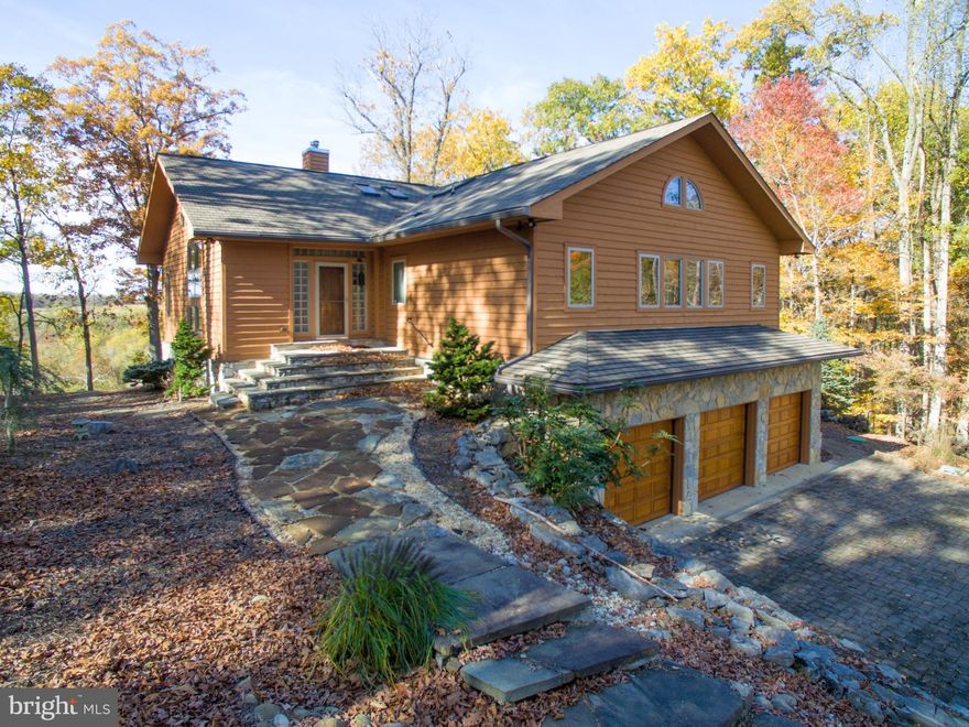 Wow, there are not enough words to describe this wonderful home sited in a small 13 lot community with private wooded home sites and river views. Access to river is community along Lot. This one has it all...decking, 3 car garage, theater room, elevator, wine cellar, gourmet kitchen, open floor plan, panoramic views, gated driveway entrance and cul-de-sac street. Lindal Cedar custom build!