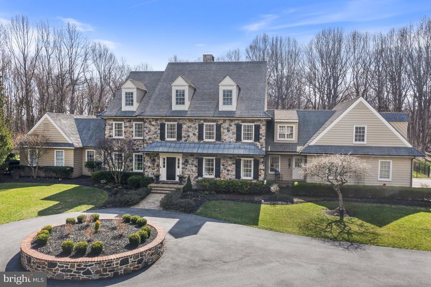 Stunning Chester County Farmhouse with historical architectural details throughout. This home has been meticulously maintained and updated with great care. No stone unturned, and no detail left out. Built in 2003 by the award winning Dewson Construction Company, is located in the desirable community of Bittersweet and the Unionville Chadds Ford School District. Enjoy absolute privacy with beautiful views out every window, minutes from Wilmington, West Chester, Philadelphia and Route 202 corridor. This 6-bedroom, 4/3 bath home features a Paradise Custom Gourmet Kitchen with French Limestone and a kitchen island with a single piece of soapstone - no seams here! The list of well thought out features goes on extensively - Primary Bedroom on Main floor with newly renovated gleaming marble bathroom. This room enjoys its own dedicated passage door that exits directly to a private covered patio overlooking pool area. What a wonderful way to start and finish each day! The home is built with real Chester County stone and cedar siding.  All windows and doors are Pella and trimmed in mahogany. Interiors include reclaimed wood ceiling beams and floors on the first level, including: Rocky Mountain and Emtek hardware on the first level, custom plumbing fixtures, 4 zone HVAC system, whole house generator and fire suppression sprinkler system. There are two laundry rooms - one the main and one on the upper floor. There is a 3 car garage which is oversized in both depth and width (no support poles to crowd access), epoxy floors and a dog bath. The property which is located on 6.8 acres is private and wooded with an in-ground heated pool and attached spa with waterfall. Come see what you have been dreaming about!