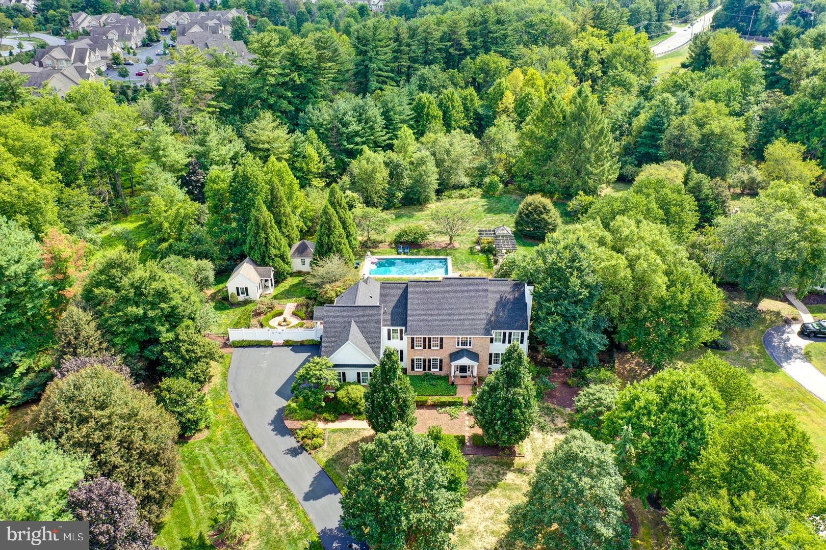 Welcome home to 24 Fox Ridge Dr located in Williston Township. This home sits on approx 2 acres in the well-established Fox Ridge neighborhood. The interior of this home offers 6 bedrooms, 5 1/2 bathrooms, a chef's kitchen with all new appliances and high-end finishes ideal for entertaining. Upon entry, the foyer has vaulted ceilings with a variety of architectural details such as crown moulding, wainscoting and a beautiful crystal chandelier. From the foyer, there is access to formal dining and living room that includes a cozy gas fireplace. Once in the large family room, you’ll find cathedral ceilings and large windows that frame the gorgeous backyard and gazebo. The main level also includes a study, laundry room, in-law suite and a sunroom with heated floors. The chef's kitchen has an extra large island and ample room for an extended kitchen table. The upper level offers 5 bedrooms including a stunning master suite with a large walk-in-closet and an ensuite bathroom with a soaking tub. The newly finished basement includes a climate-controlled wine cellar, wet bar, exercise area, sauna, full bathroom, gaming area and a media room with an extra large TV. The exterior yards feature glorious gardens, a walk-out gazebo, custom Bluestone Terraces with a PA River Stone Wall, a glistening heated salt water pool and a heated year round in-ground Spa. This home underwent stucco remediation in 2021 (replaced with siding) including all new windows and a new roof.