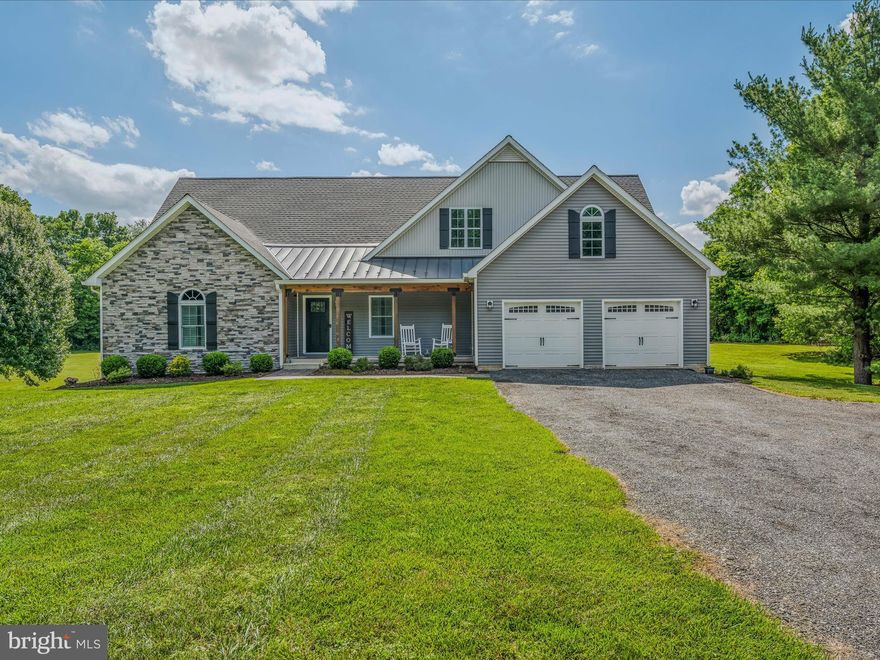 Welcome to your dream home! This stunning custom-built rancher, crafted in 2018, is nestled on a picturesque 3.15-acre lot. Surrounded by the beauty of nature, this home offers a perfect blend of modern amenities and serene country living. This meticulously cared-for property is the ideal place to call home, located near the charming towns of Shepherdstown, WV, and Charles Town, WV.

Each of the 4 bedrooms is designed for comfort and privacy. Whether you need space for family, guests, or a home office, these rooms offer flexibility and coziness. The bonus room over the garage is perfect for a playroom, office, or guest suite, offering endless possibilities. The full unfinished walk-out basement is ready to be customized to fit your needs, providing ample storage space and potential for additional living areas. The attached 2-car garage keeps your vehicles safe from the elements, while the detached 28' x 28' garage, complete with a versatile bonus room, is ideal for car enthusiasts, hobbyists, or extra storage. Enjoy the outdoors on the beautiful paver patios, carefully crafted & perfect for entertaining, dining, or simply relaxing in your park-like yard.

This property offers a peaceful retreat from the hustle and bustle of everyday life. The setting is adorned with mature trees and lush landscaping, providing a serene backdrop for your new home. Imagine morning coffee on the patio, summer barbecues with friends, and star-filled nights by a fire pit – all in your own backyard.

Built in 2018, this home has been meticulously maintained, ensuring it is move-in ready. High-quality finishes, thoughtful design, and attention to detail are evident throughout the property. From the moment you walk through the front door, you'll feel the warmth and care that has been put into this home.

The local area offers a unique blend of history, culture, and community. Shepherdstown, known as one of the oldest towns in West Virginia, is steeped in history. Stroll through the historic district and explore charming shops, cafes, and landmarks. Home to Shepherd University, this town provides a vibrant educational atmosphere with cultural events, performances, and lectures open to the community. With the Potomac River and C&O Canal nearby, there are plenty of opportunities for kayaking, hiking, and biking. Nature lovers will feel right at home.

Charles Town is another fantastic community offering modern conveniences and small-town charm. Enjoy a variety of restaurants, cafes, and entertainment options, including the popular Hollywood Casino at Charles Town Races. Charles Town hosts numerous events throughout the year, such as farmers markets, festivals, and parades, fostering a strong sense of community. With easy access to major highways and close proximity to Washington, D.C., and Baltimore, MD, this location is perfect for commuters and those seeking a quiet retreat with urban amenities nearby.

Don't miss the opportunity to own this incredible custom rancher home. With spacious living areas, high-quality finishes, and a prime location near Shepherdstown and Charles Town, this property has everything you need and more.  Your dream home in West Virginia is waiting for you!