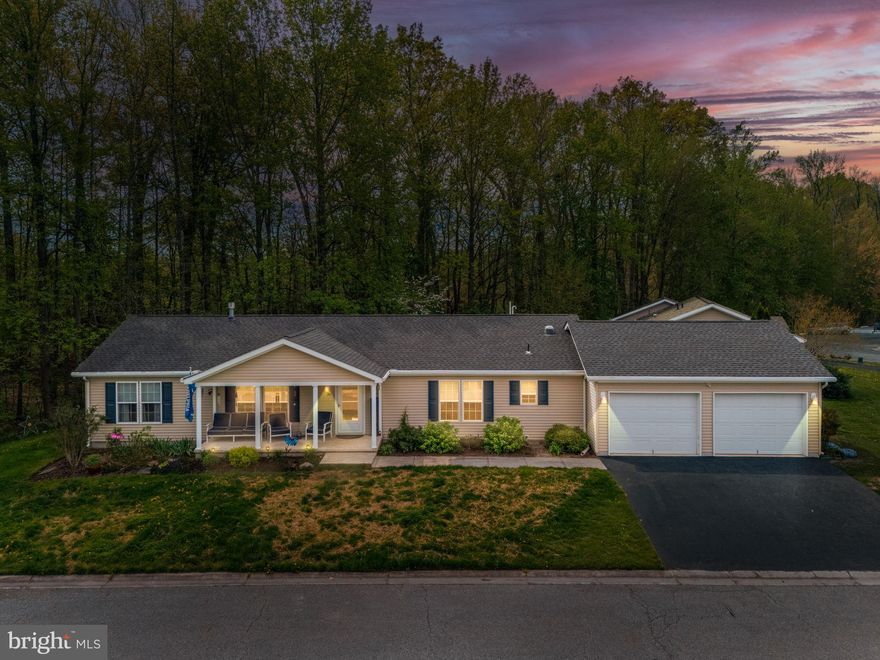 This meticulously maintained and beautifully updated ranch home sits on a quiet cul‑de‑sac in Dover’s desirable Wild Meadows 55+ community. Enjoy true single‑level living with hardwood flooring, crown molding, and a welcoming living area featuring a corner gas fireplace. The kitchen offers corian countertops, a walk‑in pantry, and a full appliance package, with an adjoining breakfast room overlooking the wooded backdrop. Insulated shades in kitchen area. Washer, dryer plus 2 wall mounted TV's included.

Outdoor spaces include a 19' x 9' rear deck resurfaced in 2025 and a charming 21' x 6' covered front porch. The backyard backs to trees, providing privacy and a peaceful natural setting. Major updates include a newer roof, new gas heater (2025), new water heater (2025), and new insulated shades (2025).

Wild Meadows residents enjoy a clubhouse, fitness center, outdoor pool, walking paths, and a full calendar of social activities. The location is ideal—just minutes from Route 1 for easy access to hospitals, shopping, dining, entertainment, and convenient travel north or south.

A meticulously cared‑for home, serene wooded views, and an active 55+ lifestyle make this a standout opportunity in Wild Meadows.