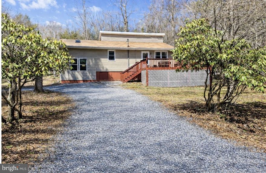 This 3 bedroom/2 bath home located in Indian Mountain Lakes offers a flexible Layout and bright open living space and natural light throughout. The eat in kitchen provides functional space for everyday use and easy access to the main living areas. The home featured multiple Versatile areas that can be adapted to suit a variety of needs, offering flexibility for additional living, working or guest space. Located in an STR friendly amenity-filled community with lakes, pools. and recreational options, this property is well suited for a primary residence, vacation home or investment.