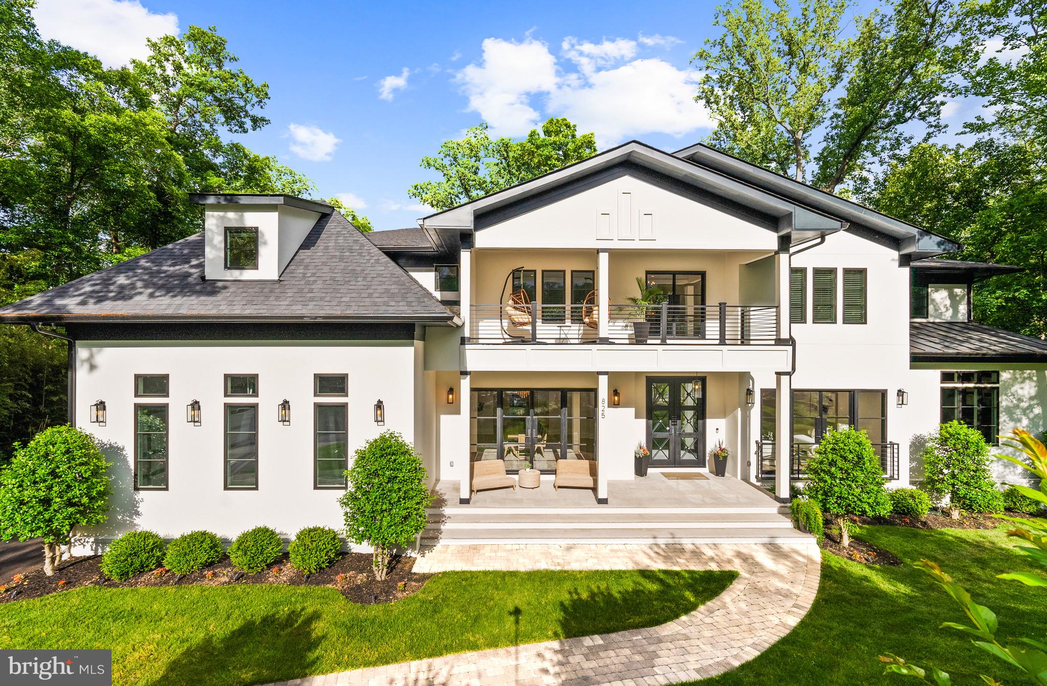 Tucked within the highly sought-after Langley Forest neighborhood, this stunning custom brick and stucco estate sits on 1.47 professionally landscaped acres. A private, park-like oasis complete with a picturesque stream that offers serene, scenic views all year round. Enhancing the retreat-like atmosphere is an infinity saltwater pool with elegant fountains, perfect for both relaxation and entertaining. Spanning over 11,000 square feet, this luxurious residence offers modern amenities, a four-car garage with soaring 15-foot ceilings (ready for car lifts), and an elevator serving all levels. Inside, the gracious foyer opens to formal living and dining rooms, while the inviting family room with fireplace seamlessly connects to an expansive deck overlooking the grounds. The chef’s kitchen is adorned with top-of-the-line appliances, including a built-in espresso machine and beverage chiller, plus the bonus of a full prep kitchen for effortless entertaining. Also on the main level is a private office, screened porch, and a mudroom with custom built-ins. Upstairs, the owner’s suite is a true sanctuary, complete with a cozy sitting room and fireplace, private balcony, dual walk-in closets, and a dream worthy bath featuring heated floors and a steam shower. Four additional en suite bedrooms and a convenient laundry room complete the second floor. The walkout lower level is designed for recreation and relaxation, offering a wet bar, fitness room, media room, bedroom, full bath, half bath, and a roughed-in space for a potential second laundry or kitchenette. Step outside to the covered porch and take in the pool, firepit, and golf putting green, all set against the tranquil backdrop of the gently flowing stream. Property includes a generator. Perfectly located inside the Beltway, this exceptional home offers easy access to top-rated schools, world-class shopping and dining, and major routes including the George Washington Parkway, Dulles Toll Road, and I-495. (**Images of optional sauna and laundry room are artistic renderings for illustrative purposes only. Features depicted are optional, available at an additional cost, and may differ in style or finish from the final product.)