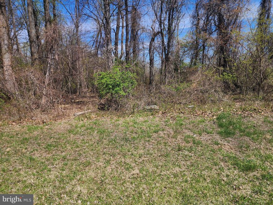 Great Location for a Dream Home. Perc Approved,  Bring your own builder, NO HOA. Across the road is a Picture Perfect 13 acre Lawn view to enjoy.  Carroll Valley Borough has a few lakes to enjoy with very nice parks, one of them has a Library located there. About 2 miles to LIberty Mountain Ski/Golf resort. The Historic Gettysburg Battlefield is only 12 miles away.. NOTE: The courthouse records have the address as being in Orrtanna which is wrong. This property is in Carroll Valley.