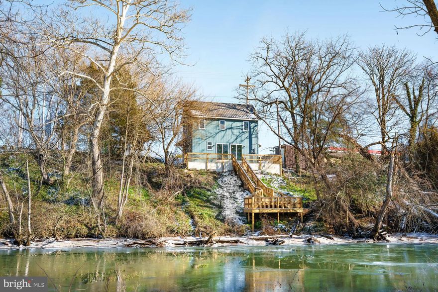 Stunning waterfront renovation on the Choptank River – completely redone inside and out in 2025!
This 2-bedroom, 1.5-bath residence has been completely remodeled from top to bottom with modern design and high-end finishes throughout. The home features all-new walls, bathrooms, appliances, kitchen cabinets/countertops and luxury vinyl plank flooring throughout, with carpet in the bedrooms. Enjoy river views from the open living area and sliding glass doors that lead to a private patio with new steps down to a landing—perfect for relaxing or launching a kayak. Additional updates include a new metal roof, siding, and driveway. Move-in ready and designed for easy waterfront living!