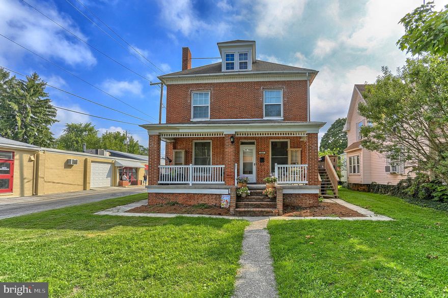 Have the tenants help pay your mortgage!  This would be a perfect house for owner occupants on the first floor and current tenants on the 2nd floor.  ***The first floor is a large apartment with a large L-shaped  open living/dining room combo with a fireplace with gas logs and built-in cabinetry.  Eat-in kitchen.  2 large bedrooms.  Remodeled bath with a whirlpool tub and separate shower.  Gas heat and central air.  Basement with a partially finished room.  ***The 2nd floor 2 bedroom apartment has been newly remodeled with new vinyl plank flooring through-out, a new kitchen and remodeled bath.  Walk up attic. 3 new window a/c units included.  ***Fenced yard.  24 x 24 two car garage and a 12 x 28 one car garage both with alley access.  ******First Floor tenants pay $925/month but are scheduled to  be out by Sept. 30.  Second Floor tenants have a yearly lease in place until May for $825/month.  Seller's business currently rents the garages for $180/month.  Landlord pays water/sewer/trash.  Tenants pay gas and electric.
