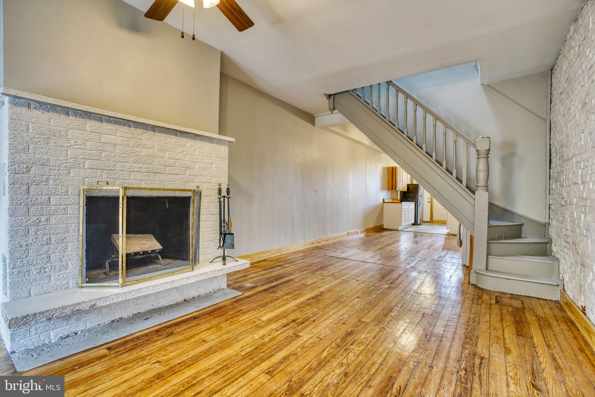 This convenient and charming 2 bedroom, 2 bath rowhome sits at the heart of the Barclay neighborhood, offering easy access to commuter routes, major employers, restaurants, shopping and downtown Baltimore.   The main level boasts abundant natural light and hardwood floors, complemented by a charming brick ornamental fireplace that adds elegance. The open living room and dining room seamlessly transition into the updated kitchen, featuring soft-close cabinetry, stainless steel appliances, subway tile backsplash, granite countertops, with access to a fenced yard.   There is also an in unit,  first floor laundry.
Upstairs, you'll find two bedrooms, one ensuite and one which would access the hall bath. Both bedrooms have ample storage space and with two bathrooms, it's perfect for roommates or families. One bathroom includes a tub and the other has a custom-tiled walk-in shower.  
If you need more space, there is plenty of storage in the unfinished basement. 
Major commuter routes such as I-95, US-40, and I-83 are easily accessible, and it is just a short distance to Penn Station, Station North, Charles Village, Mount Vernon, Downtown, Johns Hopkins University, Union Memorial Hospital, Baltimore Museum of Art and much more.
The owner is looking for tenants with 650 credit and $5,250/month income. Pets are considered on a case-by-case basis with a pet rent. It is available 11/05/2025. Contact listing agent or your favorite Realtor to schedule an appointment.