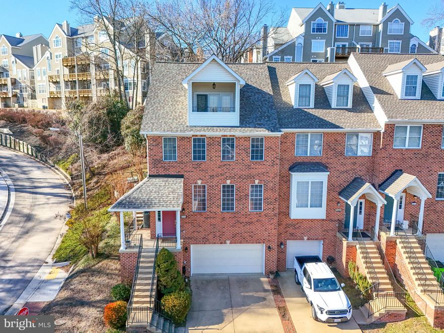 Dramatic 4 level water view townhome overlooking small yet vibrant town home Occoquan***located just 20 miles South of  Washington DC with only 1000 residents, 80+small & family owned businesses including award winning restaurants, art galleries, hair/spa services and dozens of unique shops & boutiques***This gorgeos townhome has space for all 4 levels to have an elevator installed like many adjacent properties in the subdivision (floor plan available)***Open floor plan, hardwoods, charming gourmet kitchen with fireplace in cozy family room and ceramic tiled floor in natural light morning room***The living room is spacious and offers a great view***The view from the top bedroom balcony will stop you in your tracks!!!***This wonderful end unit has a quiet patio out back and a little area for your own garden**updated appliances, tankless water heater, well maintained***Won't last long - A MUST SEE!!!