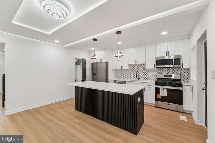 Welcome home! This is a one of a kind newly remodeled home in Baltimore! Move in ready with all the upgrades! Amazing open floor plan with fully finished basement. 3 bedrooms with 2 luxury full bathrooms. Beautiful Luxury Vinyl Plank , with upgraded countertops, stainless steel appliances and backsplash. Updated lighting throughout! Other highlights include a new HVAC system, Hot water heater, Dishwasher, Stove, Microwave and refrigerator Eat in kitchen, a huge backyard out back, and a washer and dryer. Close to lots of points of interest.