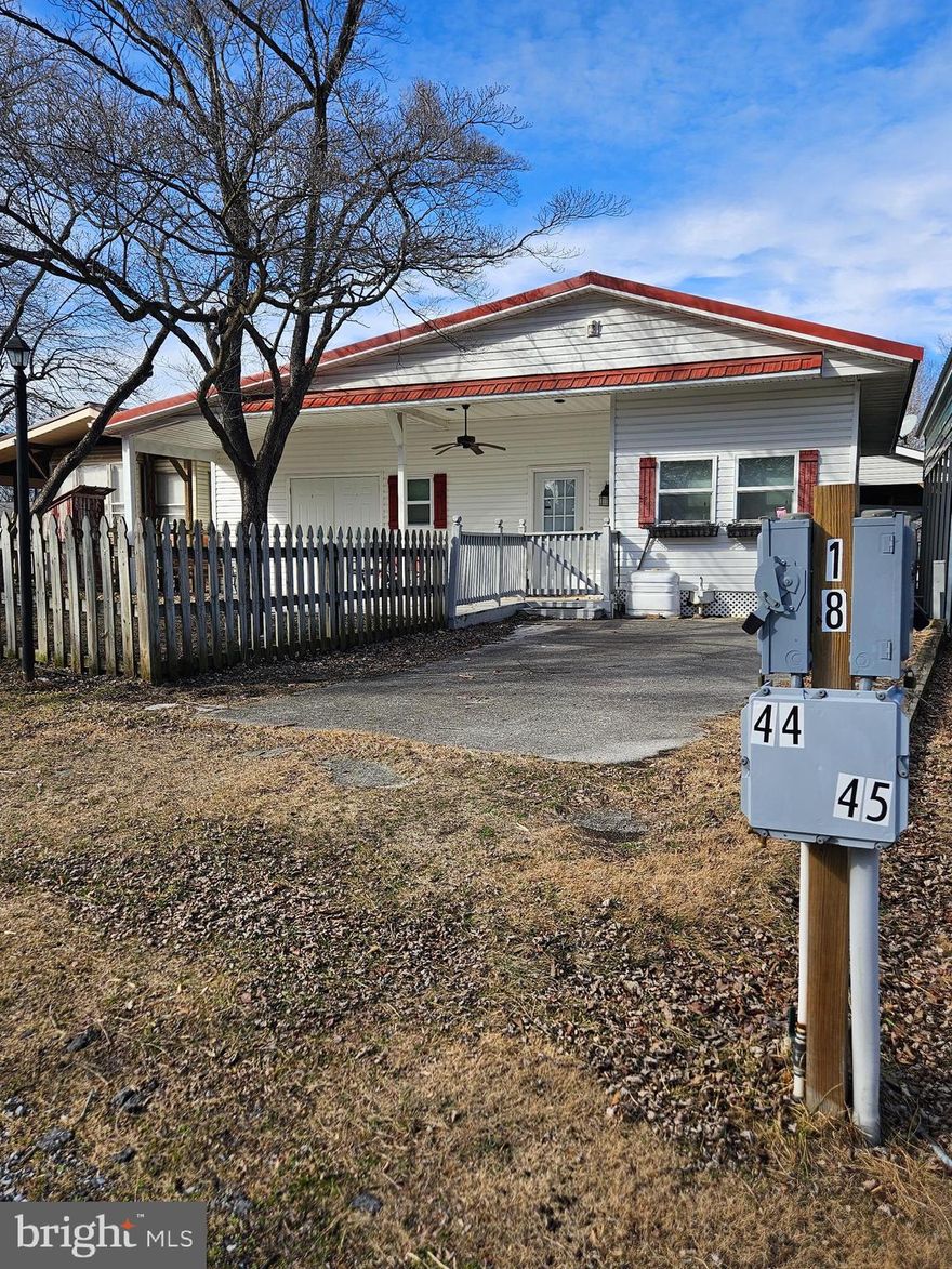 Welcome to Block 18 Lot 44 Hollow Log Rd on SEWER in Riverbends Rv Campground. Riverbend is 400 Acres of SEASONAL recreational campground full of amenities located on the Potomac River in Falling Waters, Wv. OPEN APRIL 1 - NOVEMBER 1 - This is a fun & entertaining community, yet relaxing. Financing Could be available. They require a minimum of 25% down of purchase price or appraised value.

Check out the 3 Bedroom 1.5 Bathroom Ranch style lot that could be perfect for living during the open season. A Concrete driveway pulls you right up to your fenced in yard, covered porch and into your home away from home. Fully furnished. The fully equipped kitchen has a standard size refrigerator, gas stove, built in microwave and plenty of cabinetry with an eat in dining room and table.  the bathroom off of the Primary bedroom has a large handicap accessible shower, spacious bathroom and a half bath in the hall.

 Attached is a LARGE open storage area that could be finished off for more living space, your built on Bar or kept as a garage. Everything you see conveys with this lot including the Ez Go Golf Cart.  Metal roof, updated windows, gutters and downspouts! Get your tour scheduled today!  Approx. 10 miles of Deep water on the Potomac River access for boating, fishing & swimming. Yearly membership ($1,987) plus a $200 initiation fee for new owners, includes water, sewer, electric, trash and the park amenities such as 3 pools, putt putt course, Horseshoe club, Boat club, Poker runs, Trick or Treat, Christmas in July, live bands, basketball court, tennis court, fireworks, car show, Church, restaurant, bar, convenience store (Great food), playground, volleyball, ball field and much much more. Bring your carts, water toys and come enjoy life!