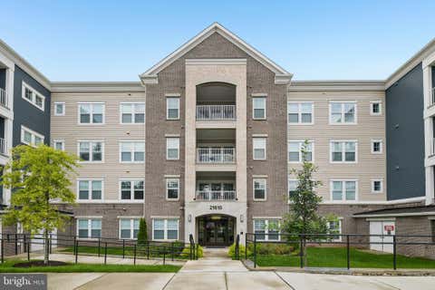 Photo of 21610 Hawksbill High Circle #102, STERLING, VA 20164 (MLS # VALO2133666)