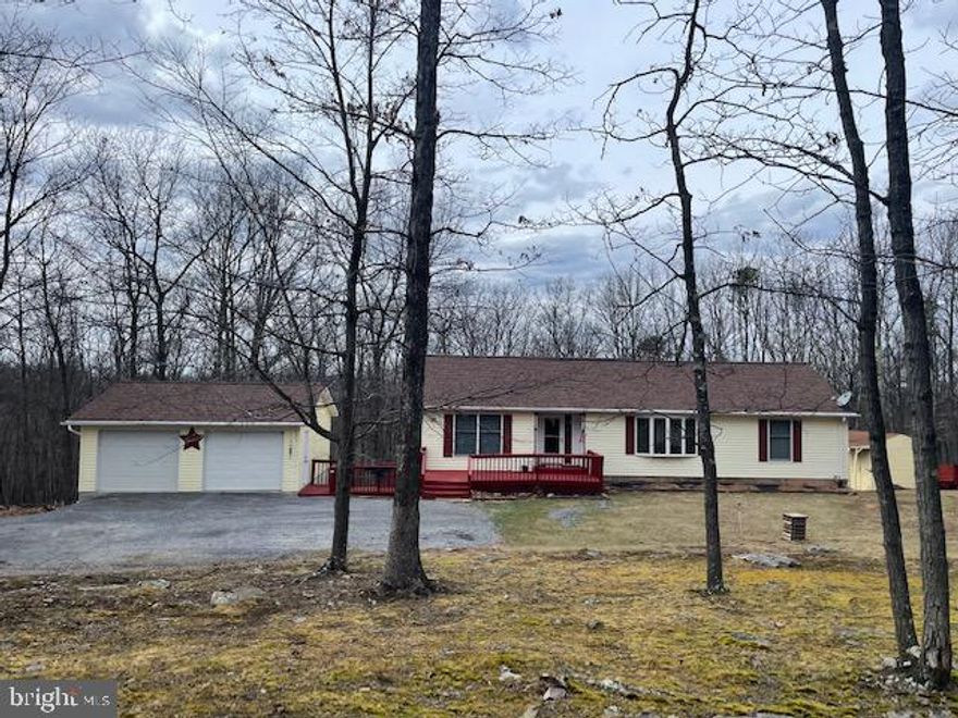 In The Heart Of West Virginia! Cacapon, Morgan County! 3 Bedroom 2 Bathroom Rancher On 5.25 Acres!
Many Updates To The Home, Including New Roof 2021, Kitchen Countertops and Appliances 2 Years Old, Beautiful Hardwood Floors, 2 Years Old. This Home Is Located In Cacapon Heights, HOA Is $135.00 A Year, Great Rural Subdivision Close to Berkeley Springs And RT 9 To WV or MD Transit and Commuter Route. 
Rancher Is Cozy And Warm, With Primary Bedroom And Bath, Roomy Closets! Entering The Home You Will Find A Traditional Layout, Formal Living Room, Kitchen With Table Space, 3 Bedrooms On The Main Level And 2 Full Baths. The Home Has More Room Than It Looks! The Basement Is Spacious, With A Recreation Room, Sitting Room/Office, Additional Storage Room With Freezer Space And Additional Room That Can Be A 4th Bedroom.  The Laundry Room Is A Large Area With A Half Bathroom.  There Is Also A Utility Room With Water Tank, Well Pressure Tank And Water Softner. Half Bath and Laundry Area Are In The Same Room. There Is Access Top Back Yard From Basement And Double Sliding Glass Door And Frame Were Just Replaced. There Is A Large 2 Car Detached Garage And Workspace. Septic System Was Just Upgraded With Another Line Added (Docs In Bright)  Seller Needs At Least 45 Days To Close

Come Home To This Spacious Rancher With Acreage And Space! Internet High Speed/Frontier
