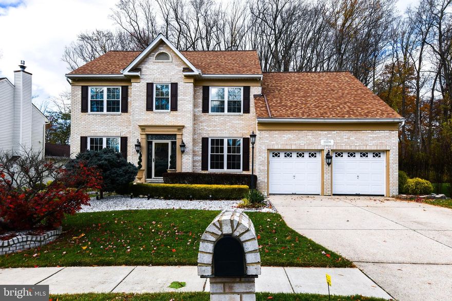 Welcome to this beautifully maintained 4-bedroom, 3.5-bath colonial home, perfectly situated in a peaceful cul-de-sac and surrounded by lush, professionally landscaped grounds both front and back. Offering elegance, comfort, and exceptional functionality, this home is designed for both everyday living and memorable entertainment. The main level features a warm and inviting layout, including separate living and dining rooms, a private library, and gleaming hardwood floors. The spacious kitchen is a chef’s delight with a center island, granite countertops, granite backsplash, stainless steel appliances, built-in granite bookcase, and heated ceramic flooring. The adjoining family room offers a cozy fireplace, perfect for gatherings. A convenient laundry room with washer and dryer and a guest half bath completes this level. Upstairs, you’ll find four well-appointed bedrooms and two full baths, including a luxurious primary suite with a sitting area, recessed lighting, and an en-suite spa-inspired bath with jet tub and steam shower. One of the secondary bedrooms features a custom built-in bookcase ideal for display or study space. The fully finished basement is designed for entertaining and productivity, showcasing custom columns, recessed lighting, a built-in office, and an impressive custom wet bar. Additional highlights include a home theater room, full bath, storage room with shelving, scrub sink room, fireplace, and walkout access to the backyard. A built-in refrigerator closet, lighting panel, and house generator add convenience and peace of mind. Outdoor living shines with an expansive patio, built-in grill and outdoor kitchen area, and underground sprinkler system perfect for hosting gatherings or enjoying peaceful evenings outdoors. The property also includes a 2-car garage with additional driveway parking. Additional features include whole-house surround sound system, security system with 7 cameras, and more.  Located minutes from major commuter routes, shopping, dining, and local parks. This home offers the perfect blend of privacy, comfort, and accessibility. A truly exceptional property you’ll love to call this home.