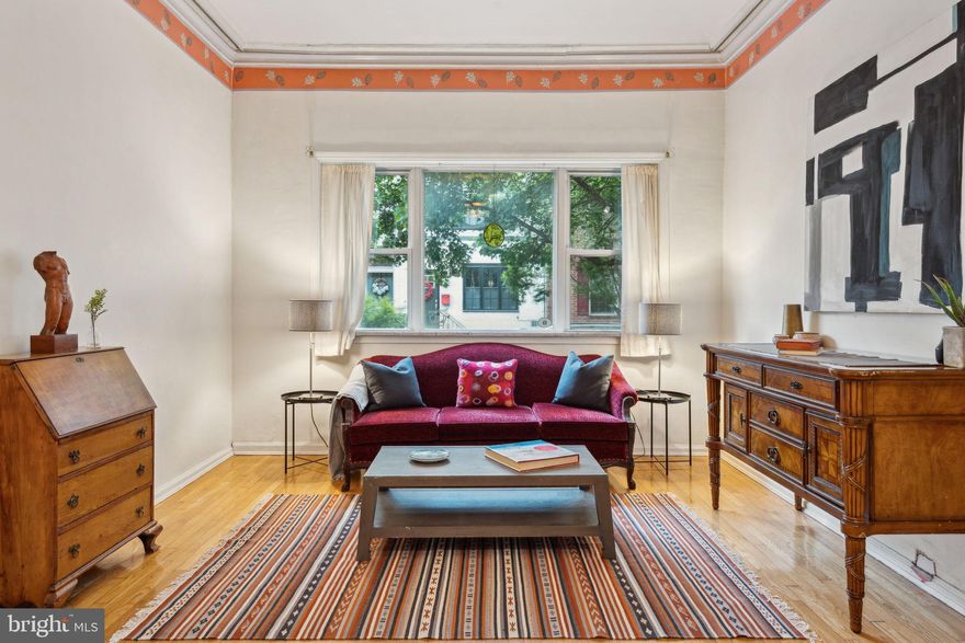 Endless possibilities abound in this Victorian townhouse in the heart of Bella Vista. This extra wide lot, 18 feet by 105 feet with an estimated 4000 sq ft of living space. Currently set up as a duplex,  but can easily  be converted back to a single family residence, this is a perfect blend of historic charm and modern convenience. The front of the house is where the one bedroom separate apartment is located. The spacious  apartment/in-law suite centers on an original decorative marble and brick mantle, with an open concept living and kitchen space, original oak floors throughout & spiral stairs leading to the  bedroom suite, which includes a private desk area & the full bathroom. The main part of the residence has beautiful historic detail, original moulding, Lincrusta heritage wallpaper adorns the welcoming vestibule  and a grand entrance to  the curved  wall leads you directly into the enormous dining area and kitchen. The dining area alone is 18.5 ft x 12 ft,  with an exposed brick wall, a built-in desk area,  pine floors and two southern facing windows. The spacious kitchen has mid century modern pine cabinets, a mini bay  garden window, a double oven and cooktop.  The side door leads to the huge private garden & 1 car PARKING, with the possibility of two car parking. A powder room is discreetly located off of the kitchen.

Ascend one flight to discover a tremendous sized living room, family room with elegant bay windows and built-in bookshelves.  The third floor offers two cozy bedrooms with versatile loft space, and a full bathroom. The primary suite on the fourth floor is a sanctuary, with exposed beams, brickwork, and an expansive ensuite bathroom featuring an original clawfoot tub. The finished basement is currently being used as both a workshop/art studio and office space.  It also houses the washer and dryer. The unfinished part of the basement holds the custom made wine cellar and extra storage. This is an exceptional opportunity to own a piece of Philadelphia's most desirable neighborhoods, with parking.  Bella Vista is an ideal walkable neighborhood with a walk score of 98 & amazing culinary experiences to be had. Buyer is responsible for verifying the square footage.