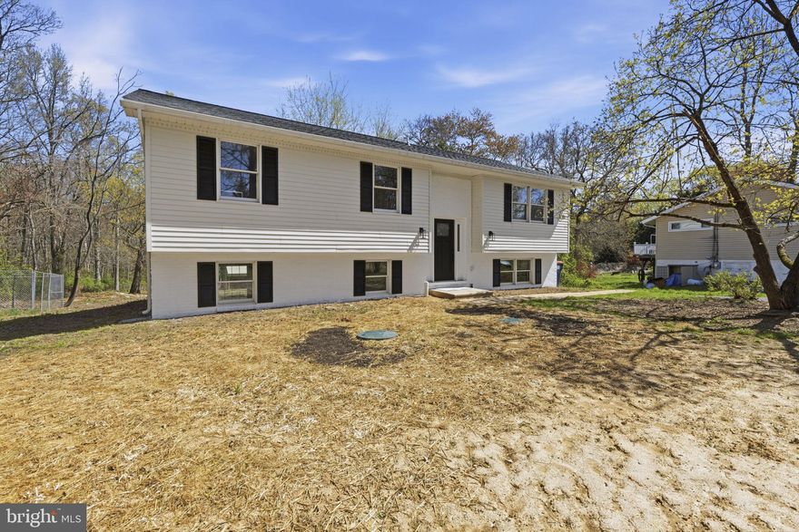 Welcome to your private oasis in Elkton! Nestled on a sprawling 1.95-acre lot in the established Elkmore community, this split foyer home offers the perfect balance of space, privacy, and endless potential. Whether you're seeking a peaceful retreat or a place to grow and make your own, this property truly delivers. Buy with confidence knowing the home features a brand-new septic system, fully county-inspected and approved—providing peace of mind. Step outside and take in the expansive, nearly 2-acre yard, ideal for gardening, outdoor entertaining, or simply relaxing in the peaceful surroundings.  Ideally situated just a short stroll (approximately two blocks) from the banks of the Elk River, you’ll enjoy refreshing breezes and easy access to local boating, fishing, and kayaking—perfect for embracing the outdoor lifestyle. Opportunities like this don’t come often—own a significant piece of land in Cecil County and create the lifestyle you’ve been dreaming of.