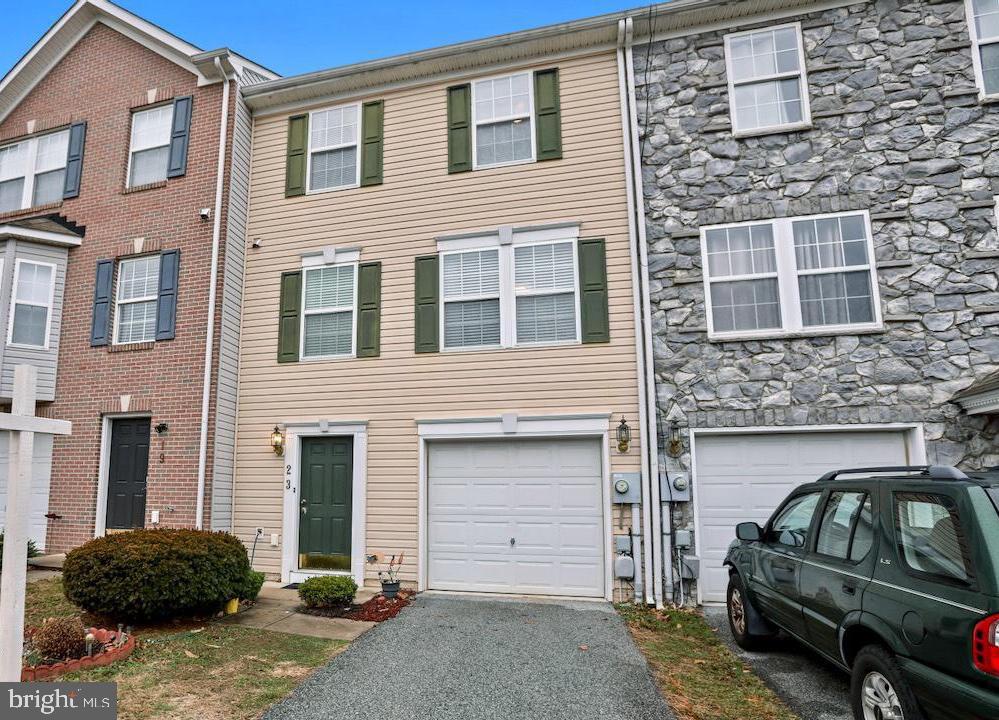 3 Level Townhome in County Green located just off Rt 340! Home features include 3 Bedrooms and 2 Bath on the top level including the Primary Owner's Suite with vaulted ceiling, walk in closet and attached private bath with soaking tub and separate shower. 2 Junior Bedrooms share a full size bath. Middle level has a NEW Gourmet Kitchen with granite counter tops, island, pantry, and adjoining Dining Area with family room and living room. Main level has a Great Room which could easily act as a fourth Bedroom, office, or lounge space with a full bath. Fully fenced rear yard with large patio. 1 car attached garage and driveway for parking! Easy access to major commuting areas, close to the middle school and minutes to downtown Charles Town with plenty of shopping and Dining! ***NEW ROOF 2022 and FRESH PAINT***