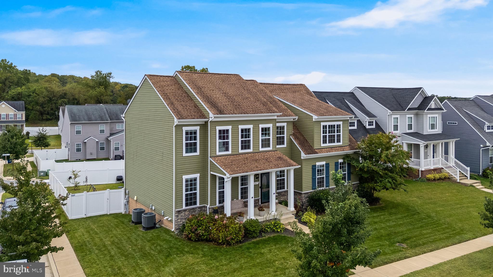 Built in 2018, this home feels better than new with fresh paint and modern updates throughout! With 6 bedrooms, 4.5 bathrooms, and multiple living spaces, there’s room for every member of the household, long-term guests, or effortless entertaining. Osborne Lane greets you with a welcoming front porch and porch swing to enjoy mornings or evenings overlooking the tree-lined, sidewalked streets. Step inside to find gorgeous hardwood floors, abundant natural light, and stylish new light fixtures that elevate the main level.
The living room offers a stone-front gas fireplace as its centerpiece and comfortably fits your largest furniture. Just beyond, the kitchen boasts granite countertops, slate appliances, a gas cooktop, and a beautiful farmhouse sink. A spacious island with seating, a breakfast nook, and a butler’s pantry with walk-in storage make it both beautiful and functional. From the kitchen, step onto your maintenance-free deck and enjoy views of the fenced yard. Looking for a home with two owner’s suites? This home delivers one on the main level and then one upstairs. The main level bedroom has its own bathroom and 9ft tall ceilings! The upstairs primary suite features a tray ceiling, private sitting room, oversized walk-in closet, and spa-like bath with dual vanities and a huge shower. Conveniently located nearby is an upstairs laundry room with sink and space for a folding table. The fully finished basement offers even more flexibility: a large rec room, additional bedroom, full bath, and ample storage. Outside, the wired shed, generator switch, and hot tub-ready hookup adds extra value. The oversized garage is large enough to fit a boat, or multiple cars and toys. All of this is set in the sought-after Clarks Rest community, where you’ll enjoy access to a clubhouse, pool, playgrounds, and basketball courts. Sellers are offering $10,000 (ten thousand dollars) towards new carpet at the current list price. A VA assumable loan at 2.875% is being offered to a VA buyer until the end of October 2025.