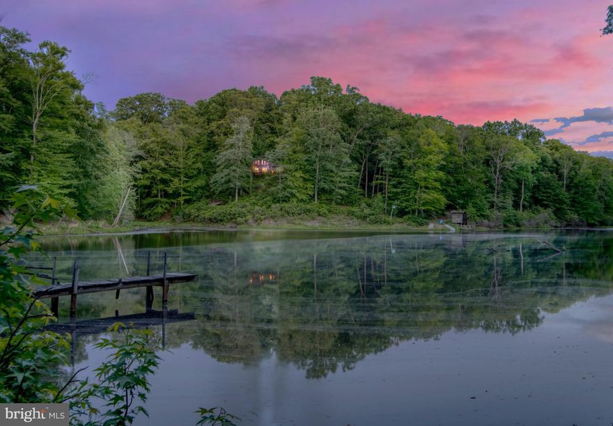 Breathtaking custom built 4BR 3FB log home on over 12 acres of privacy with an approx 5 acre lake on the property.  This amazing log home was custom built with peeled White Cedar logs from Greatwood Log Homes in Wisconsin.  The home features a two story Great Room with wood burning fireplace and vaulted ceilings with an open floor plan to include the kitchen and dining areas.  Also on the main level is a bedroom, full bath with a jetted tub and separate shower, laundry room and storage room with custom built cabinets.  The attached 2 car garage is also on the main level.  On the upper level is a loft overlooking the great room as well as two bedrooms and a full bath.  On the lower level is a family room with a wood burning fireplace as well as a studio style apartment/bedroom with full bath.  The log home also includes an over sized two car detached garage with a storage loft above.  In addition, there is also a 1BR 1FB in-law rambler  (currently occupied by long term tenant who would like to stay if buyer interested) with a rear deck on an unfinished walk-in access only basement.  The lake, named Lake Bud, has been stocked with large mouth bass, crappy and bluegill.  There is a dock at the dam end of the lake as well as a boat house/storage building closer to the log home.  The home is located minutes from Smallwood State Park and the Sweden Point Marina with public boat ramps.  Smallwood State Park is one of the area favorites for  tournament anglers.  If you are looking for privacy in an upscale custom built log home with its own lake, plenty of garage parking, an in-law rambler and abundant wildlife to add to the setting, but only approx 24 miles to the Capital Beltway (Rte 95/495), then look no further!  As-is Estate Sale.