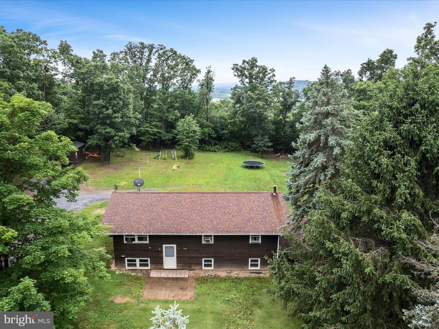 Welcome to 357 Crestview Mountain Road in Augusta, WV .  Discover the perfect blend of privacy and comfort with this beautiful split foyer home nestled in a quiet, serene setting - perfect for those who crave space. This home has a generous family room ideal for entertaining or cozy nights in. The main living area flows effortlessly with 3 bedrooms tucked in the back and a hallway bathroom.  Featuring hardwood flooring throughout. The eat-in kitchen boasts stainless steel appliances with stylish butcher block countertops.  
Step outside to the back deck and expansive backyard, creating an outdoor living environment.
Attached two car garage in the back with a long driveway for plenty of parking 
Downstairs, you will find an open unfinished basement expanding your potential for living space as well as rough-ins for another full bathroom. With a wood stove keeping you warm all winter. 
Sitting on 2.23 acres with No HOA