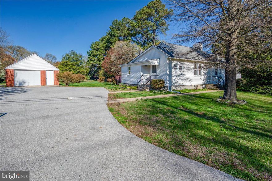 Rarely available 3BR/2BA ranch in North Wilmington with no deed restrictions, offering ideal one-level living and excellent potential for a home-based business thanks to great road frontage and ample parking. This well-maintained home features an updated kitchen with granite countertops, white soft-close cabinets, and a dishwasher, along with a bright dining area perfect for everyday meals. A front bedroom with private exterior access makes an ideal office or client space. The rear of the home offers a sunken living room filled with natural light, while the primary suite addition includes new windows, a private full bath, and access to a spacious family room with a fireplace. Additional highlights include a full unfinished basement for storage, a large 1-car detached garage perfect for a workshop or future upgrade, and a backyard with a wood-stained deck for outdoor enjoyment. Immediate occupancy available.