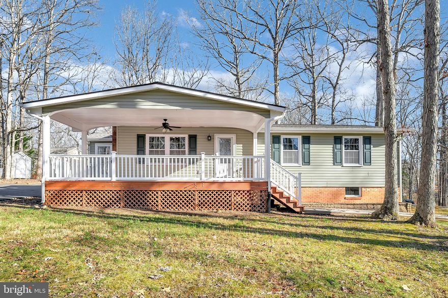Welcome to 200 Meadowview Lane!  You'll love the value that this great house, located near the front gate and golf course, provides! Warming up in front of the cozy living room wood burning fireplace in winter and relaxing on the expansive front porch in summer will become favorites! Once inside, you are greeted by newly refinished, gleaming hardwood floors in living room that continue into dining area and kitchen. The living room leads to the dining area and kitchen that boasts beautiful cabinetry and tiled backsplash. You will love the spacious family room/flex space full of light that is accessible from the side foyer as well as kitchen.  The main level owner's suite with en-suite bath, as well as two additional bedrooms and full bath, are sure to please. The lower level features a recreation room/flex space, laundry room, and oversized one car garage. A private, gated, secured community, Lake of the Woods offers anything and everything you could possibly want. Home to two lakes (the 550 acre main lake and a 35 acre "fishing lake"), a golf course, an equestrian center, a fire and rescue department, and a church all within the gates, Lake of the Woods simply has it all. Whether your passion is boating, water skiing, kayaking, golfing, horseback riding, or simply taking in the breathtaking views from the clubhouse while enjoying a fabulous meal, from your own deck or yard, or from one of the beaches, you won't be disappointed! Perhaps you'd like a game of bridge or volunteering your time and talents...Lake of the Woods offers more than 60 clubs and/or organizations from which you may choose to become involved. Located in Orange County, we are fortunate to enjoy low real estate taxes. Coupled with home prices ranging from the mid-$100,000s to over $2,000,000, Lake of the Woods is the perfect community for both full-time residents, as well as weekenders. But don't take my word for it, please come see for yourself! I will gladly give you a tour of Lake of the Woods by boat and by car so that you may experience why I love Lake of the Woods!