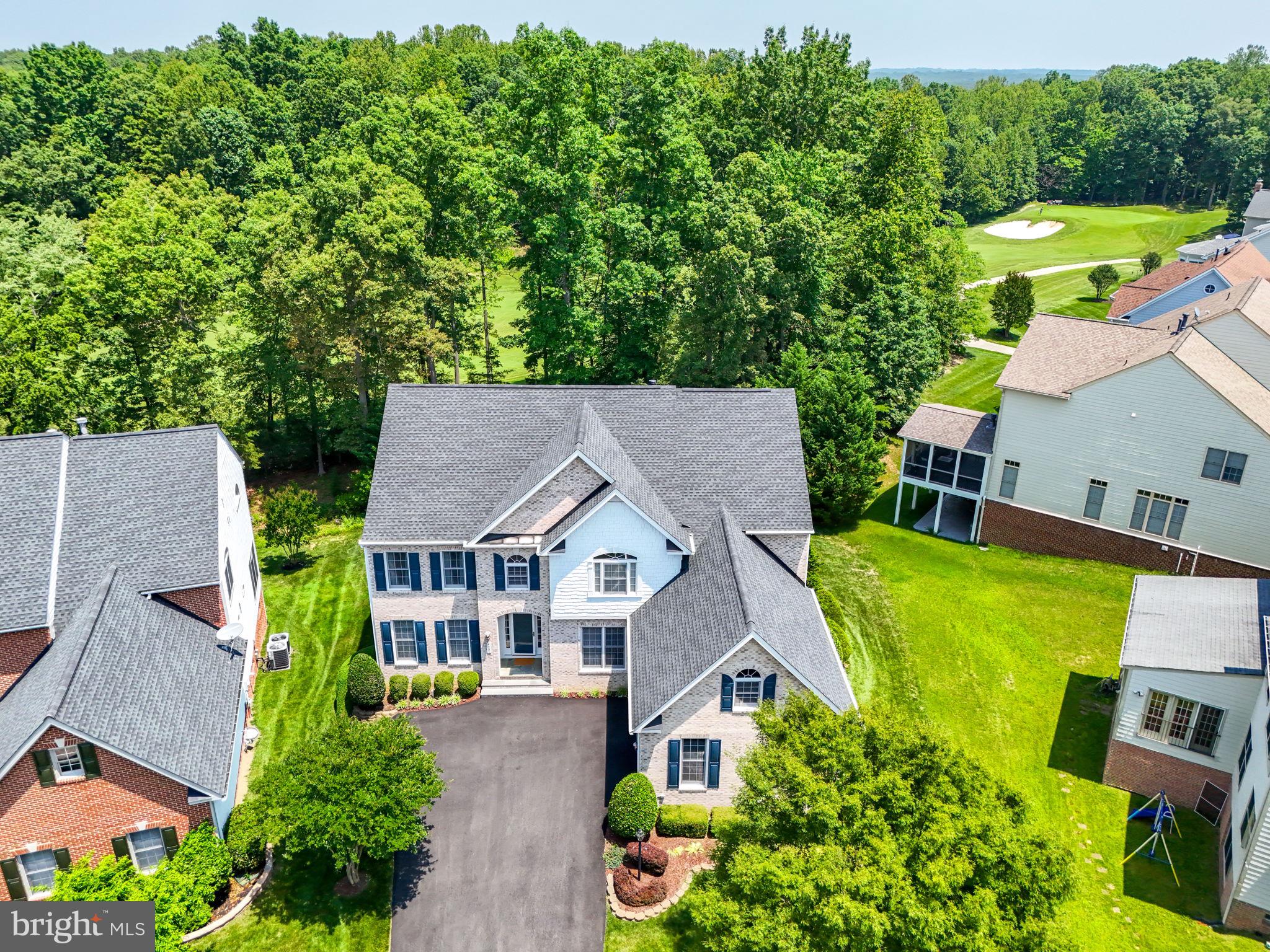 Welcome to 4801 Grandmasters Way—Luxury Living in River Falls, Prince William County’s Premier Golf Course Community! This stunning Craftmark Westchester model is nestled in the prestigious River Falls neighborhood, home to the renowned Old Hickory Golf Course. Perfectly situated with sweeping views of the 14th hole, this 5-bedroom, 4.5-bath estate offers over 5,400 square feet of luxurious living space and is zoned for the highly sought-after Colgan High School, Westridge Elementary, and Benton Middle. Inside, you’ll love the open-concept floor plan—ideal for modern living and entertaining. The heart of the home is the gourmet kitchen, featuring a huge center island, walk-in pantry, corian countertops, and premium appliances. Step out onto the low-maintenance Trex deck and take in the tranquil golf course views, all while enjoying rare privacy. Upstairs, four generously sized bedrooms all offer walk-in closets, including a Jack-and-Jill bathroom between the third and fourth bedrooms. The luxurious owner’s suite includes a spa-like bath and ample closet space. The fully finished walkout basement is an entertainer’s dream, complete bar, fifth bedroom, full bath, and access to a custom stamped concrete patio. Oversized two car garage with plenty of space for work bench and shelves which convey. This home is beautifully maintained with numerous updates including:
• New HVAC (2025)
• Water Heater (2023)
• Upstairs AC Unit (2018)
• Roof Replacement (2016)
• Updated Exterior Paint, Driveway, and Refrigerator
Live just minutes from Stonebridge at Potomac Town Center, Wegmans, VRE/commuting options, and the scenic Potomac River. River Falls offers the perfect balance of natural beauty, modern amenities, and top-tier schools—all within a close-knit golf course community. Don’t miss your opportunity to own one of the finest homes in River Falls!