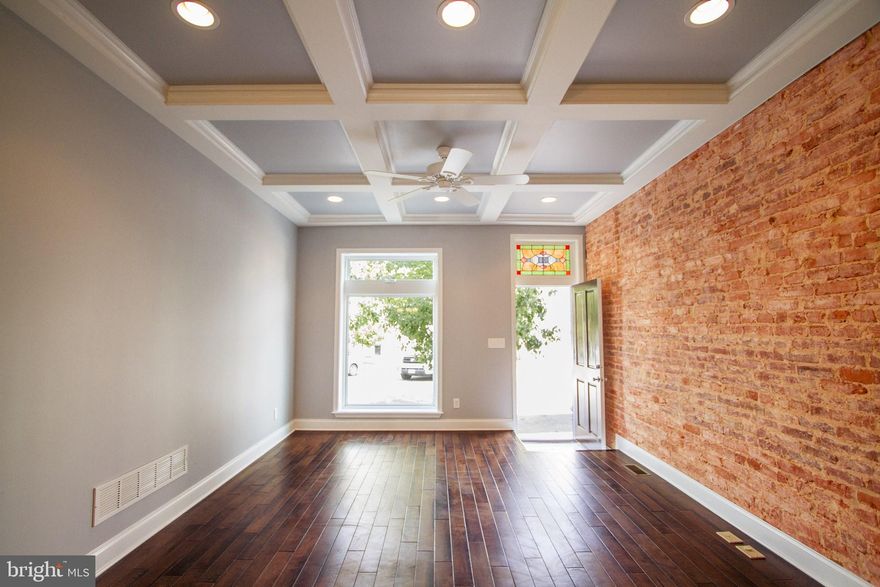 Welcome Home! 3 BR 3.5 BA  rowhome in Highlandtown. Hardwood floor on main level and 2nd Floor.  Gourmet kitchen with Quartz countertops and marble herringbone backsplash.  Large Kitchen Island perfect for entertaining.  Half bath on main level.  Large primary bedroom with walk in closed and in suite bathroom.  Ceramic tile in all bathrooms.  Finished basement with full bath and bedroom with Den in rear.  Pop Down roof top deck.