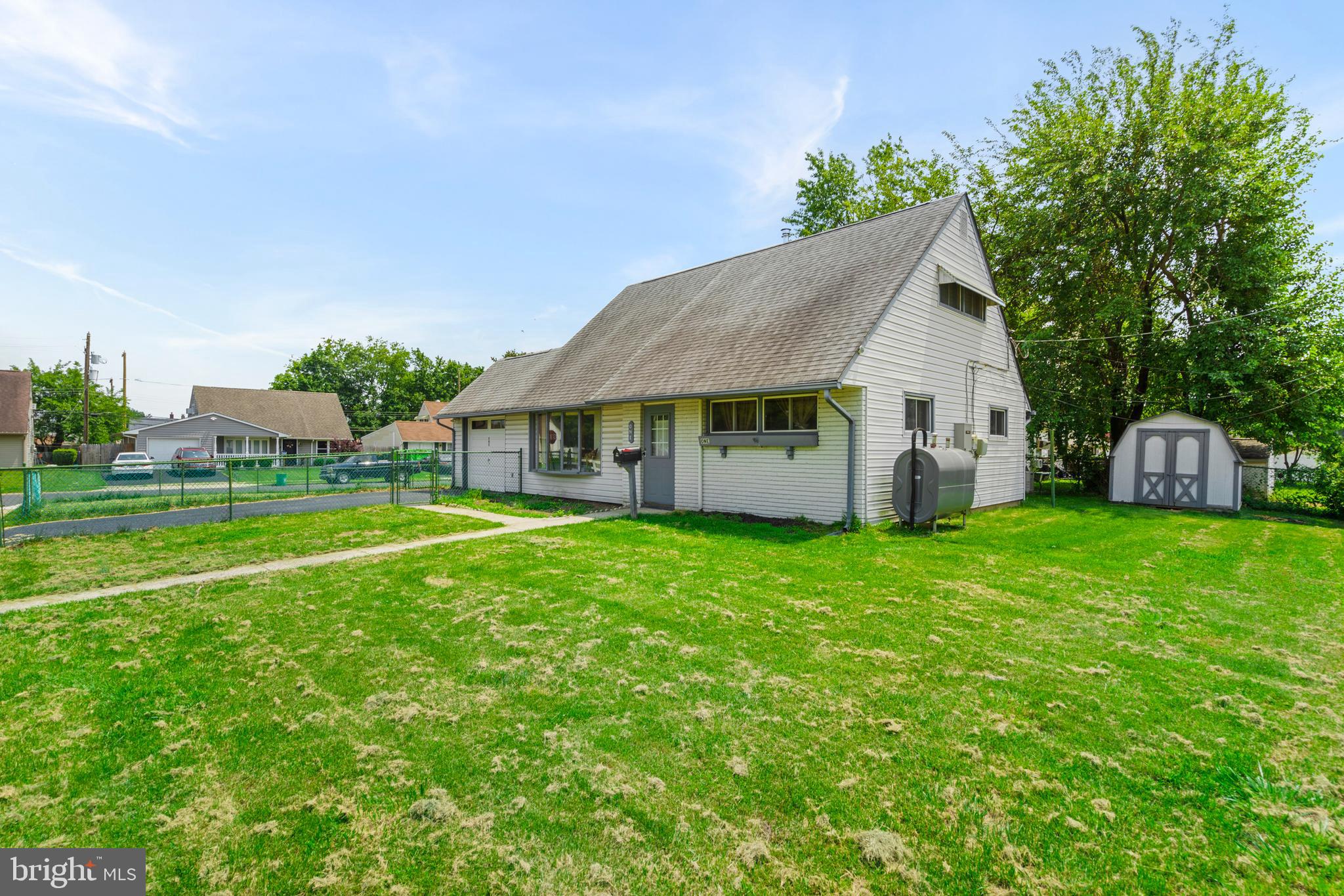 This move-in ready home sits on a .18-acre corner lot and features a spacious layout with fresh updates throughout. Enjoy all-new laminate flooring, fresh paint, updated lighting, brand new Samsung washing machine, and painted kitchen cabinets with new hardware. The main level includes a new washing machine, two hall closets, a full bathroom, and two versatile rooms—one with brand-new flooring, fresh paint and a closet nook (perfect as an office), and another that has new gray carpet, a ceiling fan with light, and a closet.
Stay comfortable year-round with efficient mini split systems and oil-based heating (tank replaced just 2 years ago). Upstairs, you’ll find two bedrooms, including a primary suite with a generously sized closet, new light fixture and fan, and a refreshed full bathroom with tub.
Additional highlights include a detached garage, fully fenced-in yard, enclosed porch, walk-up attic for storage, outdoor shed and a Generac propane generator.
This home offers a fantastic blend of value, comfort, and flexibility—with the added bonus of a potential 5.75% assumable mortgage rate well below today’s average. Buyer must qualify with Penny Mac. Showings begin at the open house!