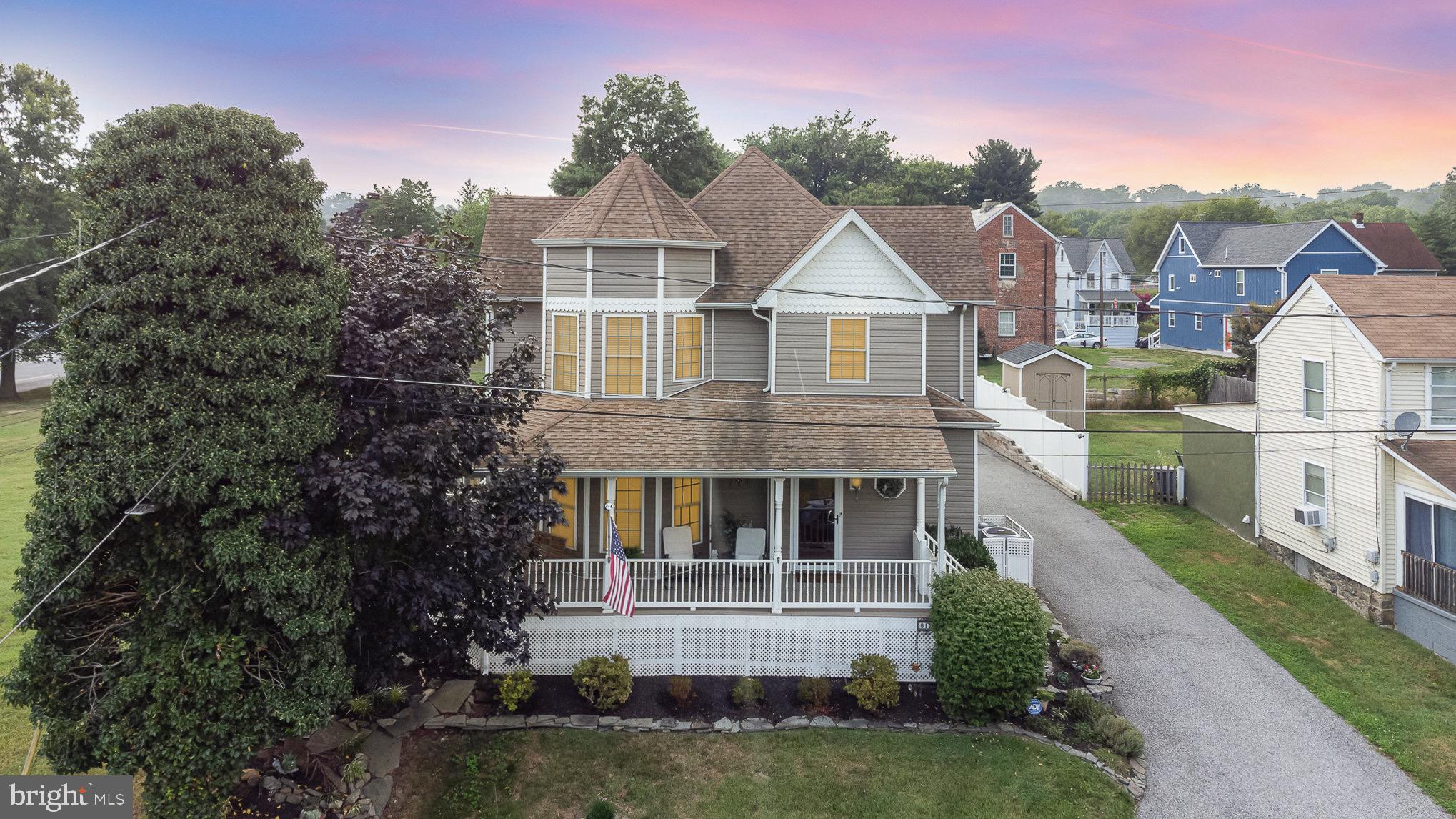 Welcome to "the Castle on Locust Rd" this elegant 3 bed, 3 full bath custom home was built in 2007 with integrity and high quality craftsmanship, no detail was left untouched. This home sits minutes from Rt 40 and I-95 but also just two and a half blocks from the water and offers partial water views in summer and clear water views in the fall/winter. Two blocks away at the end of Erie St lies the marina and just a couple blocks more brings you to all the shopping and restaurants that downtown Havre De Grace has to offer. There is also a children's park and walking trail at the end of Locust Rd.
Pull into the large driveway and park in the oversized (400 sq ft) two car garage and enter in through the back of the home, or walk the steps to the massive wrap around front porch. Swing on the swing or sit in a rocking chair and admire the views with vacant lots to the side and to the front with water beyond. Entering through the front door brings you to the main level which is covered in high quality cherry wood flooring. To the left is a family room, which could also serve as a formal dining room if you prefer. This flows into the dine in kitchen which has granite countertops, a granite island, custom ginger glazed cabinetry and all stainless steel appliances. A door off of the kitchen area leads to the garage and also to the rear yard. This backyard is like your own private oasis, with high privacy fencing you are in your own world. Admire the landscaping out back, the stone patio that runs along the side of the house to the rear yard, the rock gardens and flower gardens, and garden pond with small waterfall. There is a retractable awning on the side patio, and a $10K hot tub with a pergola in the rear. There is also a chicken coop that can either stay or go at buyers preference.
Back inside, exiting the other side of the kitchen brings you to a large living room with an electric fireplace and wood mantel. The step down next to this room that leads to the basement has a full bath with tub/shower combo at the top of the basement steps. Heading into the fully finished basement brings you to an entertainers dream with a custom bar with fridge and plumbing nearby, a theatre room with a $9K theatre/sound system, an adjoining recreation room with stone laminate flooring, a pool table and a bar to watch TV from while you eat. Down here you will find the mechanical room with an 80 gallon hot water heater and one of the two HVAc units (This property is dual zoned).
Heading to the upstairs brings you to a large owners suite with great views out of the bay windows, a large custom walk in closet, and private bath with jacuzzi tub and shower. Also on this floor is another full bath with tub/shower combo, as well as two more bedrooms, one of which has its own private office or bonus room for whatever your needs may be. No expenses were spared on this home. The carpet on the third floor is new, there is custom trim and crown molding throughout, cieling fans throughout, ring doorbell, security lights and camera and the whole house is prewired for cable. This home is truly one of a kind, a unique gem in historic Havre De Grace and is waiting for you to come call it home!