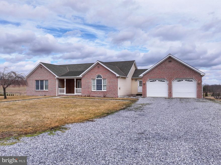 Well-maintained ranch home situated on over 2 acres with stunning panoramic countryside views. The main floor features an open and functional layout with three bedrooms and 2.5 baths, living room, formal dining room, and kitchen offering oak cabinetry and a breakfast bar that opens into the family room creating a great space for everyday living and entertaining. Laundry hookups are also conveniently located on the main floor. The partially finished walk-out basement provides excellent additional living space with a kitchenette, two bonus rooms suitable for bedrooms, ¾ bath, large recreation area, and a generous storage room with built-in shelving. Outdoor features include a recessed covered front porch and a composite rear deck, ideal for relaxing or entertaining while enjoying the scenic views. The attached 24' x 30' two-car garage provides plenty of space for vehicles and extra storage. Additional features include generator hookup, a Kinetico water system, central vacuum, and a recently replaced heat pump.