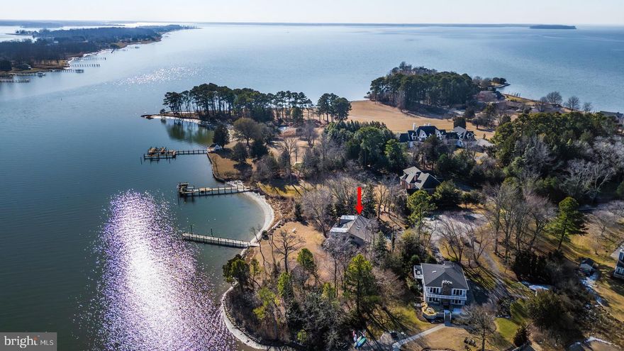 This lovely waterfront home is tucked away on a quiet cul-de-sac in desirable Prospect Bay. Thoughtfully designed and built by the original owners, this home offers approximately 2796' of well-planned living space providing 4 bedrooms and 2.5 baths.  The open-concept floor plan is enhanced by distinctive architectural details and abundant natural light.  A bright kitchen opens to the family room with fireplace—perfect for everyday living and entertaining. The spacious living room features a vaulted ceiling with skylights and opens to a loft area above.  The main-level primary bedroom offers water views, a large walk-in closet, and a full bath with soaking tub and walk-in shower.  Upstairs, you’ll find three additional bedrooms plus a dedicated office space.  Enjoy outdoor living on the wrap-around deck, accessible from the living room, kitchen, and primary bedroom.  Additional features include an oversized two-car garage and private pier on a tranquil waterfront setting. Roof is 2 years old and carpet is new.  Home is being sold As-Is. Buyer to verify water depth.  Prospect Bay amenities include Golf, Pool, Boat Ramp, Tennis Ct, Club House with restaurant/bar/grill plus more.