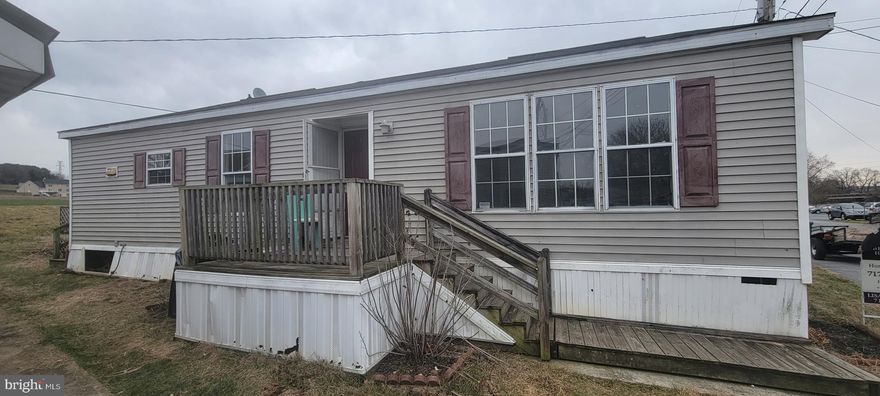 Spacious 3BR & 2FBath  1990 Doublewide in Conestoga Manor Mobile Home Park. Freshly painted interior & new flooring throughout! Nice kitchen with light maple-stained wood cabinets, solid surface countertops & breakfast bar open to the dining area. New Refrigerator & Stove! Large living room with ceiling fan & 3 windows allowing for lots of natural light. Primary Bedroom has a walk-in closet & private bath with a large vanity & walk-in shower.  There is storage shed out back & a large deck that overlooks the farm behind.  The deck & exterior needs some TLC, but could be very nice with a little work. Enjoy affordable park living with lot rent of $450/mo that includes sewer & garbage. Located just minutes to conveniences & Rt 222. Take a look today!!