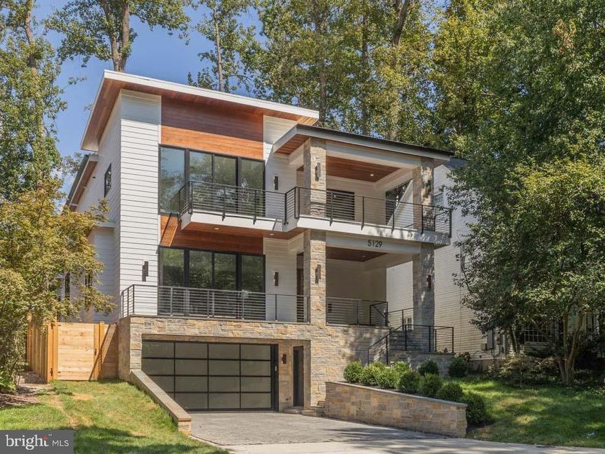 ** Open House Sunday 11/23, 2:00pm-4:00pm ** Take your time exploring the home! We’re available to answer any questions throughout your visit. ***PRICE IMPROVED - MOVE IN FOR THE HOLIDAYS!  - ***Mohican Hills Masterpiece***  this brand-new ERB home defined by its grand-scale open layout, where space, and style converge for modern luxury living. Designer lighting, oversized windows, white oak hardwood floors, and expertly appointed finishes set the tone throughout. At the heart of the main level is a show-stopping quartz kitchen with a massive center island, JennAir appliances—including a 6-burner gas range, separate wall oven —and abundant cabinetry. The kitchen flows seamlessly into a formal sitting area with access to a spacious balcony, a light-filled great room anchored by a gas fireplace, and a dramatic dining room—perfect for both everyday living and elegant entertaining. A walk-in pantry provides ample storage.   The center French doors open to a private patio and large fenced yard surrounded by lush greenery. A stylish home office and a designer full bath with a glass-enclosed shower round out the first floor.
 
The second level offers a convenient laundry room and four large bedrooms, each with an attached ensuite bath. The primary suite is a true retreat, featuring a covered balcony, two expansive walk-in closets, and a spa-inspired bath with double vanity, dual shower, and large soaking tub. The lower level is designed for ultimate flexibility. A spacious rec room with wet bar and wine fridge sets the stage for gatherings, while a mirrored workout room with padded flooring provides a dedicated fitness space. An additional bedroom and full bath for guests, and a practical mudroom with built-in cubbies connects directly to the two-car garage. Connecting all levels is a floating staircase wrapped in glass, leading to the crowning jewel: a rooftop terrace offering a private escape for relaxation or entertaining.
 
All this in the beloved Glen Echo Heights neighborhood with mature trees and wooded lots. Nestled near Potomac Palisades Park with fields and a path to Sangamore Shopping Center, and less than 4 miles to 2 Metros, Friendship Heights, Palisades DC, Bethesda Row, the new Westbard Center, and a host of restaurants and amenities.