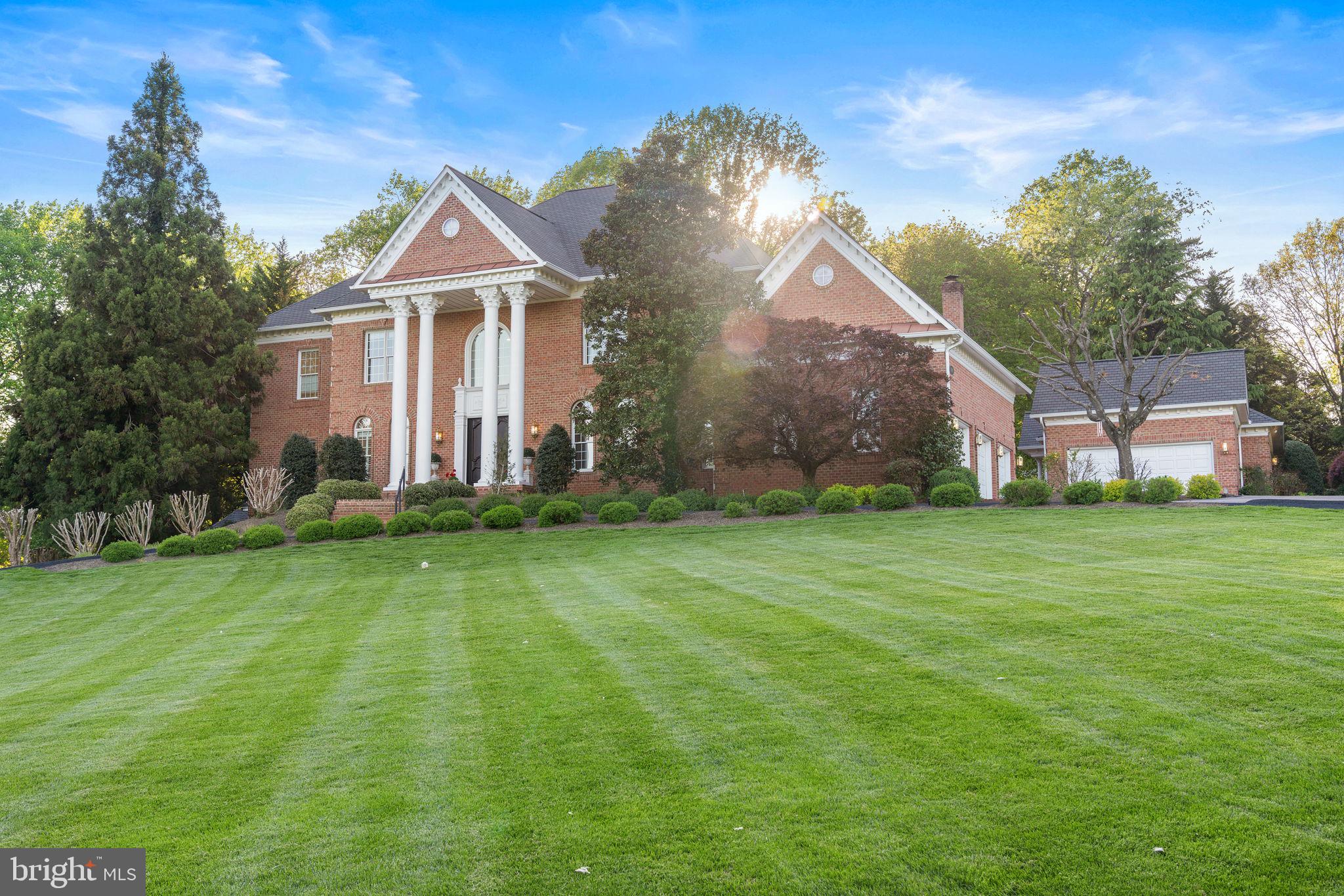 This is a rare chance to call one of Oakton's grandest properties home; a private 5-acre oasis conveniently tucked away in one of Northern Virginia's most exclusive neighborhoods. Available for the first time in nearly 20-years, this 7 bed, 7 full bath, 2 half bath all-brick colonial is as impressive in its stature as it is in its comfortable livability. If you have ever driven down the gently winding Hunter Mill Road, you have seen the grand columns of 2619 Sledding Hill Road standing afar on a lush, pristine lawn. What you don't see on this drive are features that make this home truly special - the oversized 5-car garage, private sports court for tennis and/or pickle-ball, in-ground pool, multiple private outdoor living areas including patio and screened-in porch, or separate 2-story 1,500 sqft guest house well-equipped with a full kitchen, 1 bed 1 bath, and a woodworking shop. The halls beam with life and charm and is laid out perfectly for hosting family and clients alike; this is a home happiest when lived in and ready for its new owners.