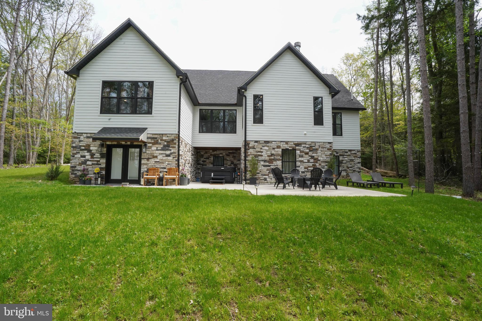 Craftsman elegance awaits you at this newly built home just minutes from Deep Creek Lake, Wisp Resort, Swallow Falls the Youghiogheny River and all of western Maryland's finest attractions! No details were missed! it would be very difficult to recreate this home today at this price with today's building costs. Offering 5 bedrooms, 3.5 bathrooms and over 5400 square feet of living space, this home offers space to entertain guests in style and comfort. The kitchen offers many of the finest finishes you would desire including quartz countertops, Signature appliances, coffee bar and more! Hardwood floors greet you throughout the main level. Enjoy the many living spaces including the main level living room which adjoins the speakeasy room with a wood burning fireplace, as well as two additional living areas downstairs. All of the bathrooms offer custom tile and marble work. Heated bathroom floors will keep you comfortable year-round. The lower level patio offers a hot tub and a private setting to relax and enjoy the mountain air. An oversize garage provides ample space to keep out of the elements. A Generac whole house generator will keep the entire home powered on the toughest of conditions. Whether you are looking for a primary residence, vacation home or investment property, it is certain that 2045 Swallow Falls Road will check many of the boxes you are looking for in your search. Call today to schedule your private tour of this exceptional home! Showings by appointment only.