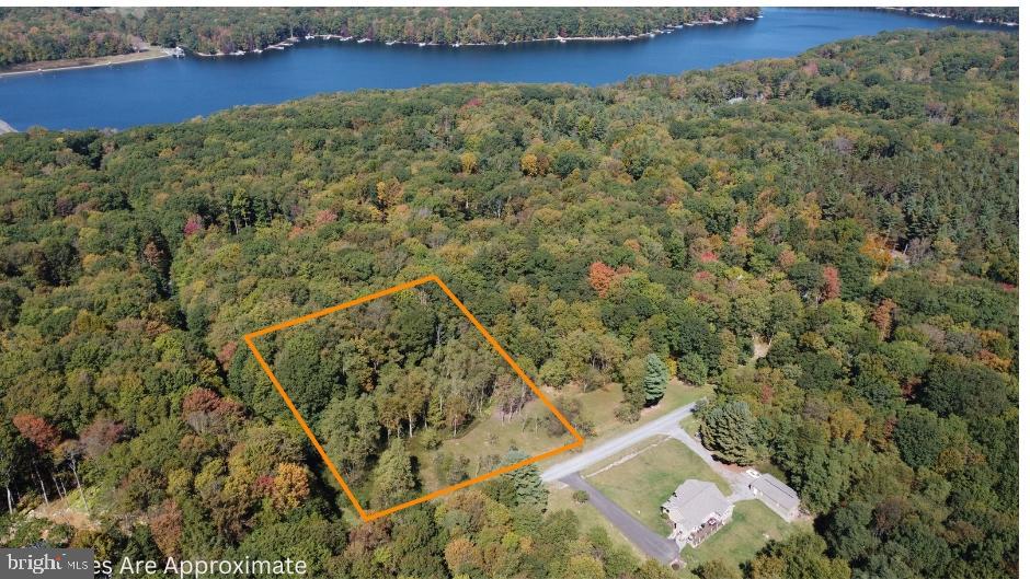 Discover a serene slice of paradise with this stunning 1-acre land opportunity, perfectly nestled among lush trees and tranquil woods. This picturesque setting offers a peaceful retreat from the hustle and bustle of city life, inviting you to create your dream home in a natural haven. This lot is partially cleared on the front and completely level. Close to Deep Creek Lake and all it's amenities while uniquely located in quiet surroundings.