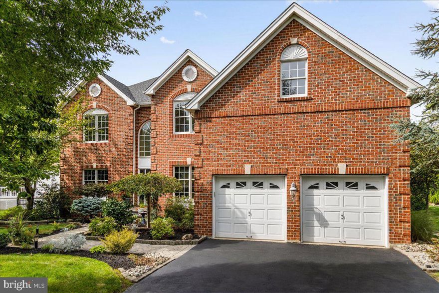 Tucked away on a quiet cul-de-sac in the highly sought-after Buckingham Forest community is this beautifully updated Columbia Style brick home within the National Blue-Ribbon Award-Winning School District. From the moment you walk through the front door, you’ll be impressed by the wide-plank Brazilian Koa hardwood floors on the main level, the two-story foyer, and tons of natural light that streams through the home. To the right of the entry is a private front-facing study perfect for those work-from-home moments and the need for quiet focus. To the left, a spacious living and dining room combo is ready for holiday dinners and cozy conversations. The heart of the home is the kitchen with a custom center island with a gas cooktop, cherry cabinetry (with updated hardware), lovely fixtures, newer stainless-steel appliances including double ovens, a built-in microwave, dishwasher and a bright breakfast area with French doors leading you outside. Additionally, there is a nook that is currently serving as a coffee bar or can be used as a place to host your devices.  Right off the kitchen is a cozy, two story great room with a stone-front gas fireplace, perfect for movie nights or curling up on chilly evenings. A back stairwell provides access to the second floor, an impressive feature to this home. Upstairs, you’ll find four generously sized bedrooms, including a primary suite with a sitting area, large walk-in closet, and a spa-inspired bath complete with dual shower heads, stone base, dual vanities, and a private water closet. Even the shared bathroom has been updated with granite countertops; no detail has been overlooked! A true luxury is experienced when you step into your private, fenced-in, backyard oasis. The custom in-ground pool has swim jets, a hot tub, stone waterfall, built-in fire pit, and lush trees that give you the perfect mix of privacy and shade. The landscape lighting throughout this property adds a  magnificence throughout the gardens, along the walkways, and around the patio and pool. Whether you’re hosting friends watching the game while soaking in the hot tub, chatting on the paver patio, grilling, or just lounging in a hammock, it’s your own slice of paradise. This home checks all the boxes: space, function, beauty, and location. Just minutes from charming Doylestown, New Hope, and Newtown, and super convenient to NJ, NY, Philly, and regional SEPTA lines for commuting. Welcome home!

Updates list is available 
Garage is 2 car plus+ extended