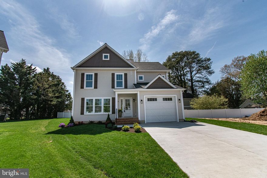 PUBLIC OPEN HOUSE SATURDAY 2/7 2-4pm.  Nestled in the charming town of Easton Maryland, this exquisite new construction home, set to be completed in early 2026, will offer a perfect blend of modern luxury and traditional elegance.  The sixth of Sandy Lane's ten total homes to be built, this design is the first with two stories that include a first floor primary and two additional bedrooms up and a 320sf family room, providing a second spacious gathering place for tv watching, reading, homework, pool table, games, the works!  It is a thoughtfully designed custom layout providing plenty of space for privacy, relaxation and entertainment. As the construction progresses, you will step inside to discover an inviting open floor plan that seamlessly connects the gourmet kitchen to the dining and living areas. The kitchen as designed is a cook's dream, with an island providing ample workspace and seating for four.  The kitchen will be equipped with custom cabinetry and elegant countertops as well as high-end appliances. The kitchen island serves as a focal point for gatherings, while recessed lighting and ceiling fans enhance the ambiance throughout the home. The interior will be fitted with luxurious vinyl plank flooring and carpeting, creating a warm and comfortable atmosphere. The first-floor primary suite will feature a huge walk-in closet and a private, beautifully finished bathroom with a custom-tiled shower.  At the interior entrance to the garage, you will find a convenient, dedicated laundry room and private powder room.  Outside, the property will be equally impressive. The extensive hardscape and beautifully landscaped front yard will create a picturesque setting, with a rear patio and front porch perfect for outdoor entertaining or quiet evenings spent enjoying the neighborhood views.  In addition to an encapsulated and climate-controlled crawl space, the exterior features include energy-efficient double-pane windows, exterior lighting, and a well-designed gutter system, ensuring both functionality and aesthetic appeal. Parking is a breeze with an attached garage with car charger, driveway space for two vehicles, and additional on-street parking available. Located on a cul-de-sac, this home will offer a sense of privacy while still being in the heart of downtown, where the vibrant community life of Easton awaits.  You will experience the luxury of modern living in a prime downtown Easton location, where every detail has been meticulously crafted to provide comfort and elegance. Don't miss the opportunity to make this stunning residence your own and enjoy the exclusive lifestyle it will offer on Sandy Lane.  Sandy Lane homes are subject to recorded Covenants and Restrictions (attached in docs) but there is no HOA or fees.  Developer: Sandy Lane, LLC, MHBR 9512.  Builder: Stansbury and Sons Home Improvement Inc., MHBR 8351. BUILDER CONTRACT REQUIRED.