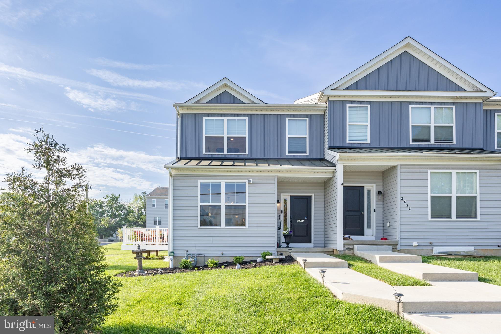 Located on vibrant Main Street in Morgantown, this stunning 3-year-old end-unit townhome offers the perfect blend of style, space, and walkability. Just steps away from restaurants, shops, and parks, this home is ideal for those who crave convenience without compromising comfort. This end unit former model home has all the upgrades plus a large vacant side lot as well as plenty of extra parking.
Step inside to soaring ceilings and abundant natural light that fills every corner of this 3-bedroom, 3.5-bath home. The spacious open floor plan includes a dedicated office space, perfect for remote work or a quiet retreat. Enjoy outdoor living on the extra-large deck with a custom awning, ideal for entertaining or relaxing in the shade. The attached garage adds everyday ease and additional storage. The main floor has an open floor plan highlighted by a chef's kitchen with high end features and natural gas cooking. Upstairs, you’ll find a luxurious primary suite featuring two walk-in closets and a spa-like bathroom designed to impress. Two additional bedrooms and a full bath on this floor, plus the upstairs laundry room makes chores a breeze. The basement has a large entertaining room with a private office and a brand-new full bathroom. This floor could easily be a second bedroom suite with a full egress and plenty of storage. Natural gas heating ensures cozy winters, and the modern construction means energy efficiency throughout. Don’t miss your chance to own this beautiful home in one of Morgantown’s most walkable and desirable locations!