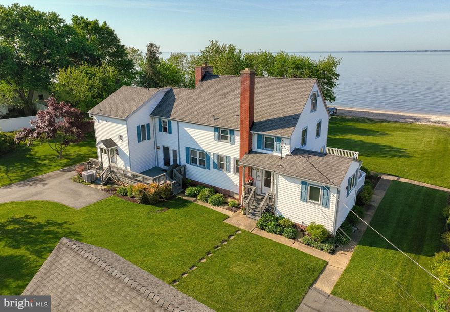 The perfect blend of old and new are here in this wonderful two story Saltbox home in Piney Point.  Phenomenal river views,  white sandy beaches and spectacular sunsets await you!! Step inside to this well maintained home with original hardwood floors, and traditional layout.  A bright open kitchen overlooking the beach and river have been upgraded to meet todays lifestyle. Just off the kitchen you will find the along with the laundry  area and 1/2 bath and pantry. The large living room w/fireplace and formal dining room  do not disappoint and feature the original hardwood flooring. You will also find space for a private office on this level.   Upstairs you will find the three spacious bedrooms,  also with hardwoods including the primary ensuite with two large closets, one a true walk in, and an updated bath with large tile shower and heated flooring.  Primary bedroom also features  a "moon window" perfect for watching the moon rise at night.  
There's more... A separate "cottage" is attached  and right next door with a private entrance , separate driveway and it's own  kitchen, living room,  bedroom and 1.5 baths and  private decks.  Outside you will find a detached shop/garage, a large deck a well manicured lawn, 85 feet of beach front and of course the view and sunsets! 
Included in this sale is an additional .333 acre lot that will be deeded separately . This lot has the ability to hook in to the public sewer and water.