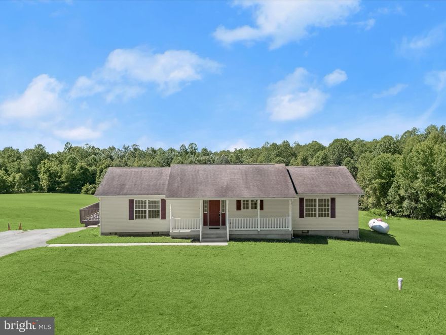 Take advantage of an assumable VA loan with a 2.375% interest rate! Discover over 72 acres in Brandywine, MD, located in Charles County, ideal for horses, livestock, or hunting. Nestled on the property is a charming ranch-style home showcasing an open floor plan with modern updates and a traditional layout. The main level features brand new flooring throughout, beginning in the sun-filled living room with hardwood floors that continue into the dining room. The dining room provides access to a spacious covered deck, perfect for relaxing or entertaining, and flows seamlessly into the beautifully updated kitchen.  The kitchen boasts quartz counters, a subway tile backsplash, 42” shaker-style soft-close cabinetry, a center island with a breakfast bar, stainless steel appliances, and a pantry. The primary suite offers a walk-in closet, abundant natural light, and an en-suite bath complete with a jetted soaking tub, walk-in shower, and large vanity. Two additional bedrooms, a hall bath, a powder room, and a laundry/mudroom with driveway access complete the interior. The property is ideal for equestrians, featuring a barn built in 2021. Inside, you'll find four 12x12 stalls with Dutch doors leading to a 12’ overhang. A spacious tack room and LED lighting enhance the barn’s functionality. Approximately 3 acres are fenced with RAMM fencing installed in 2021. A new double run-in shed was added in 2024, and a 10x12 cottage-style shed offers additional storage. Hunters and outdoor enthusiasts will appreciate over 30 wooded acres teeming with deer and turkey. With easy access to MD-381 and MD-5, this property combines the best of country living with convenient travel to points north and south. Shown by appointment only. No drive-bys, please.